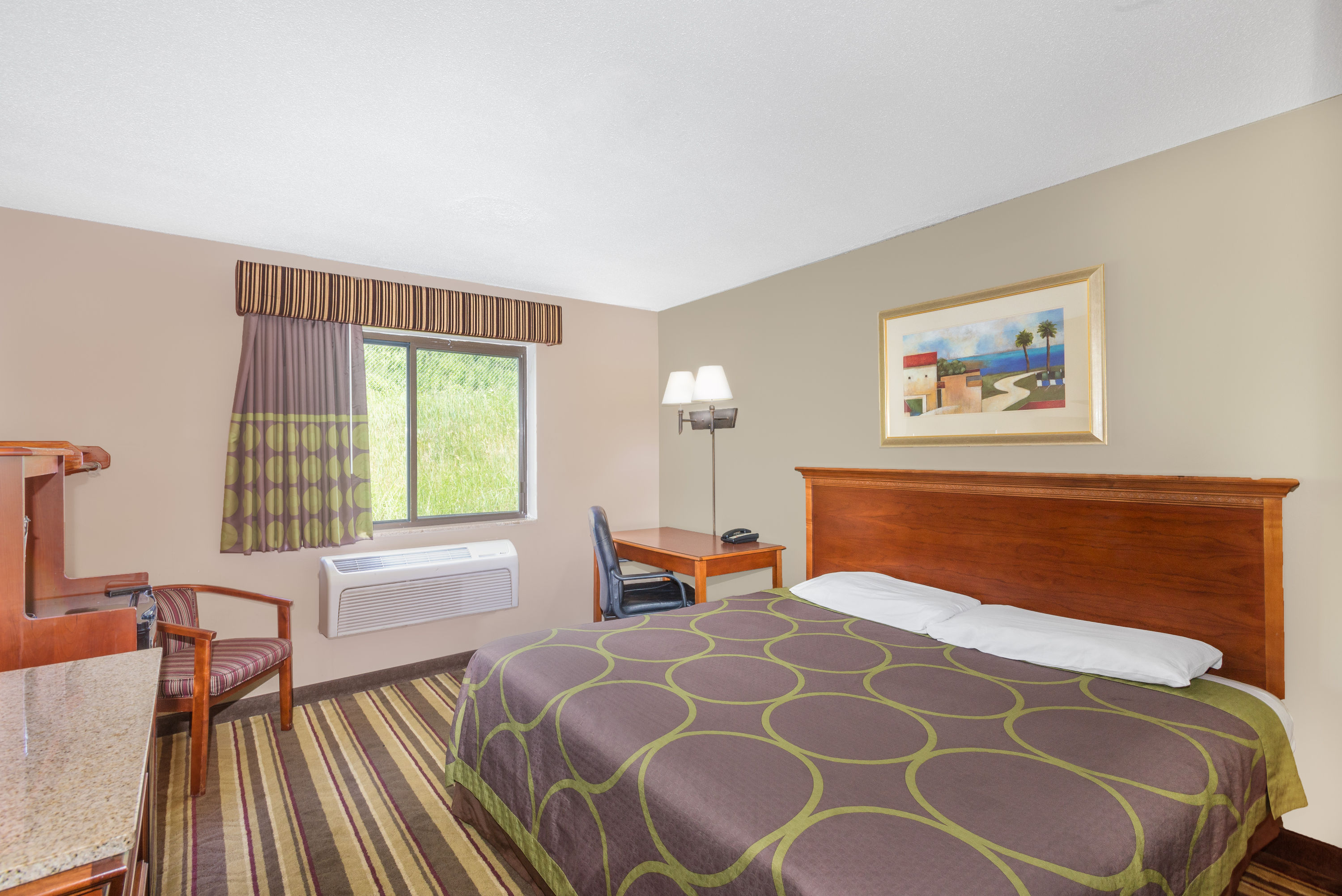Guest room at the Super 8 by Wyndham Tilton/Lake Winnipesaukee in Tilton, New Hampshire