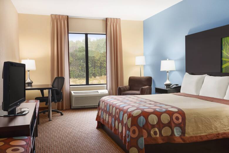 Guest room at the Super 8 Pennsville/Wilmington in Pennsville, New Jersey
