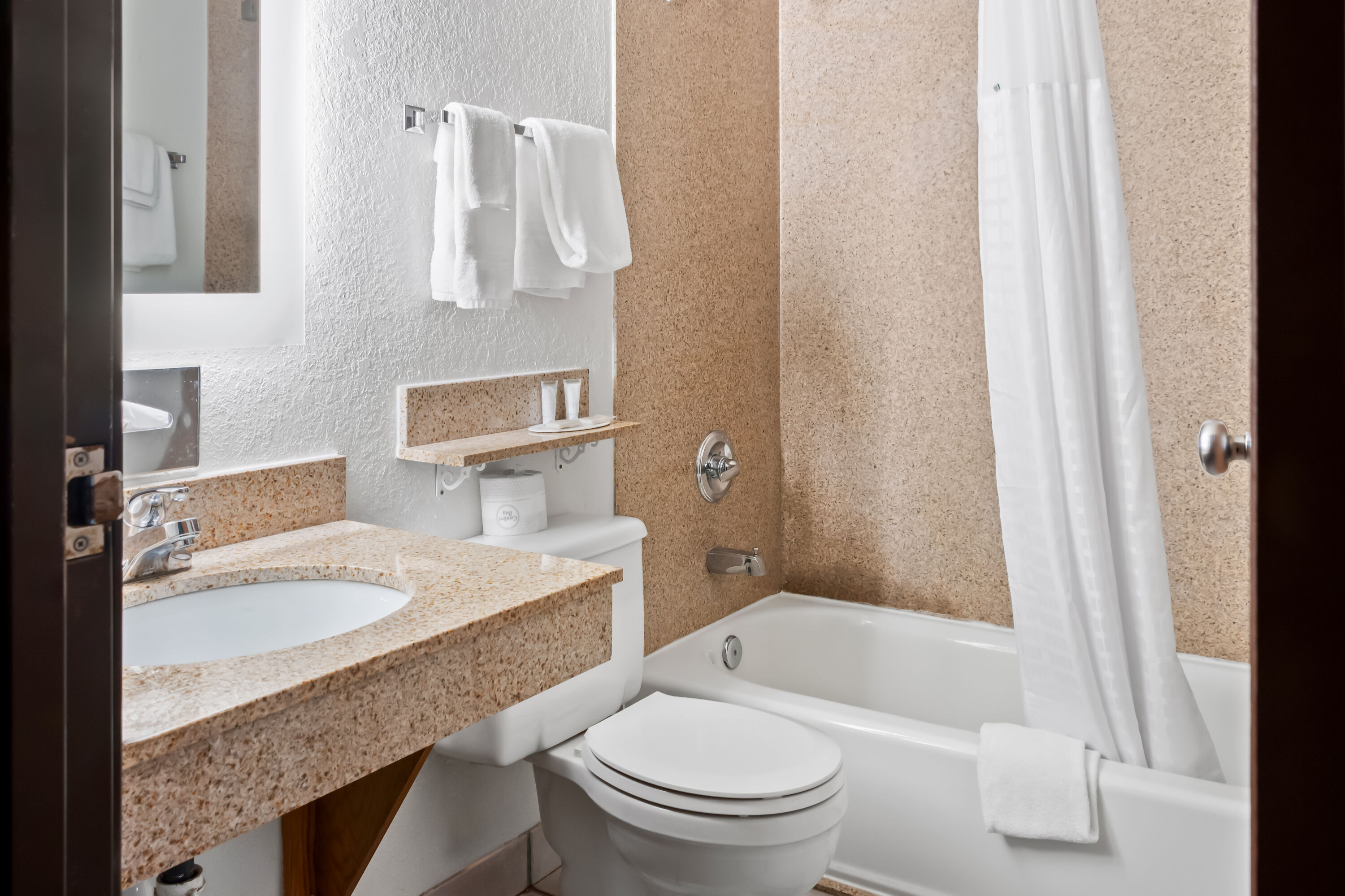 Guest room bath at the Super 8 by Wyndham Santa Rosa in Santa Rosa, New Mexico