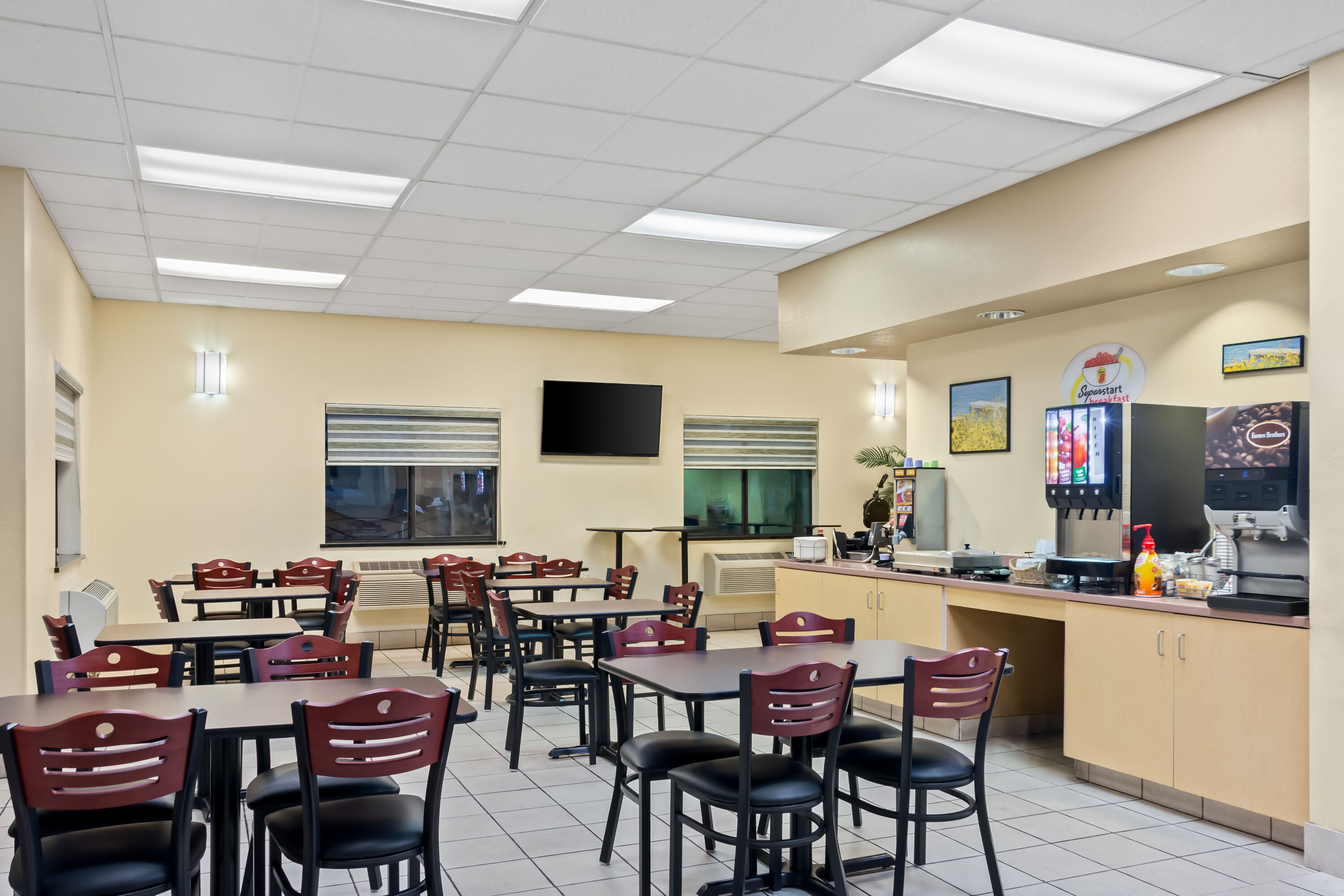 Super 8 by Wyndham Santa Rosa restaurant breakfast area with seating in Santa Rosa, New Mexico