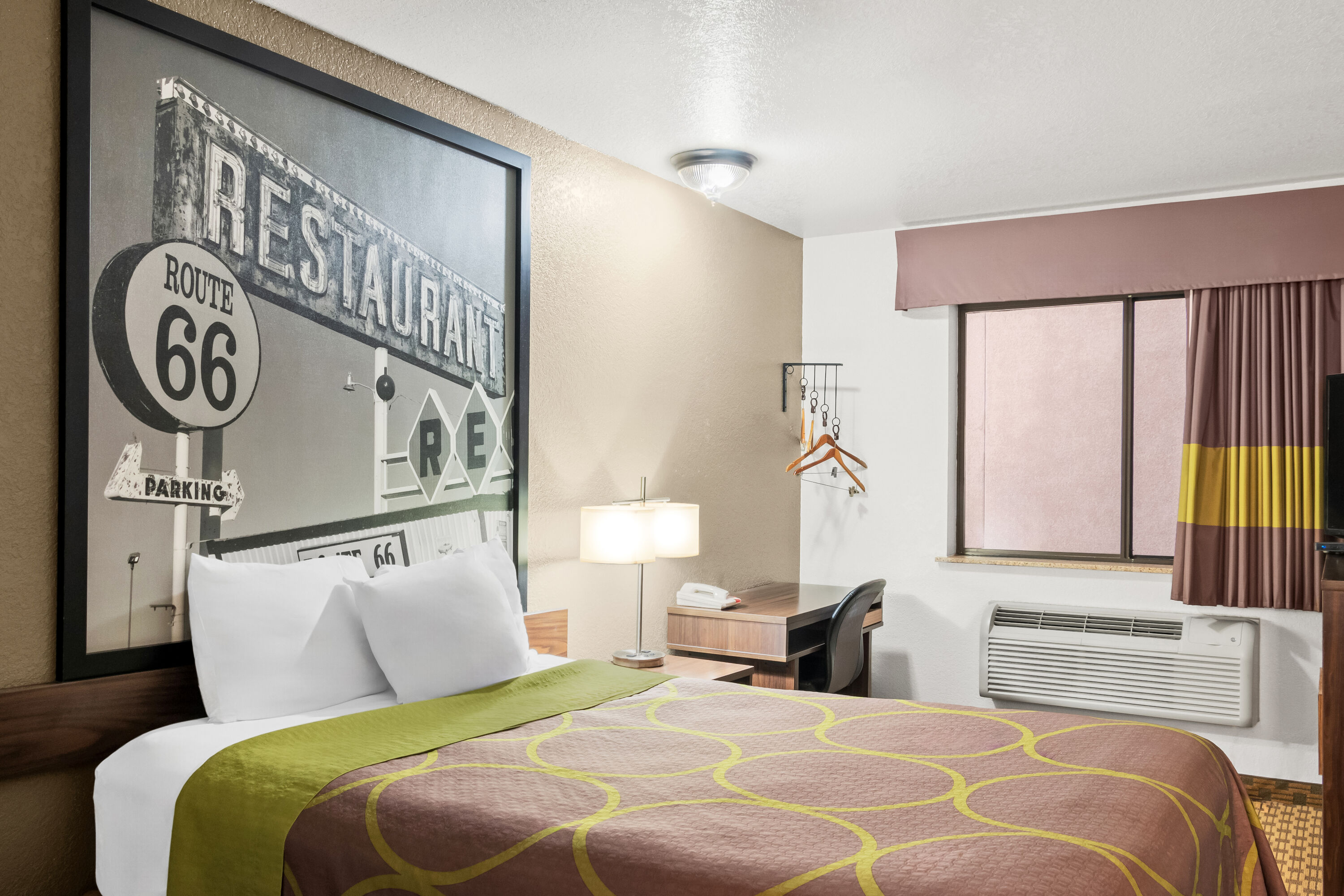 Queen bed guest room at the Super 8 by Wyndham Santa Rosa in Santa Rosa, New Mexico