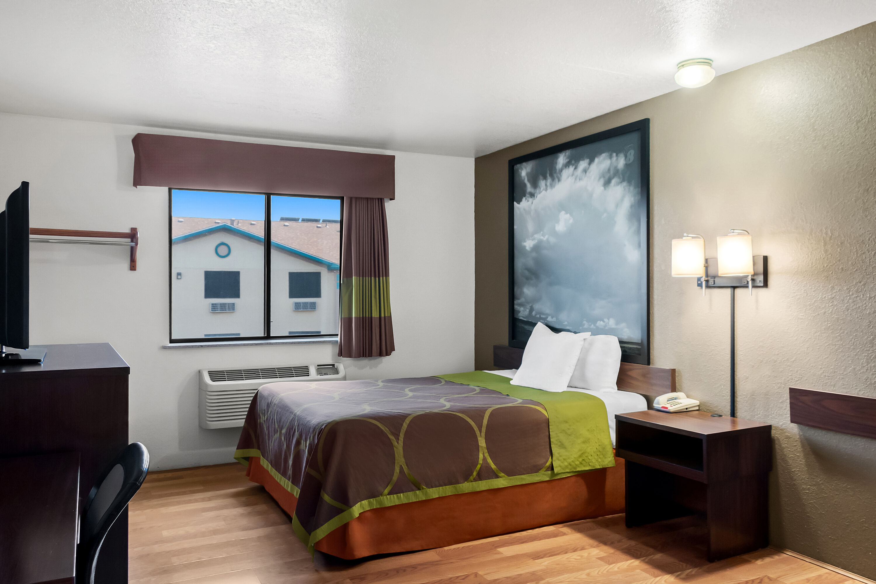 Queen bed guest room at the Super 8 by Wyndham Santa Rosa in Santa Rosa, New Mexico