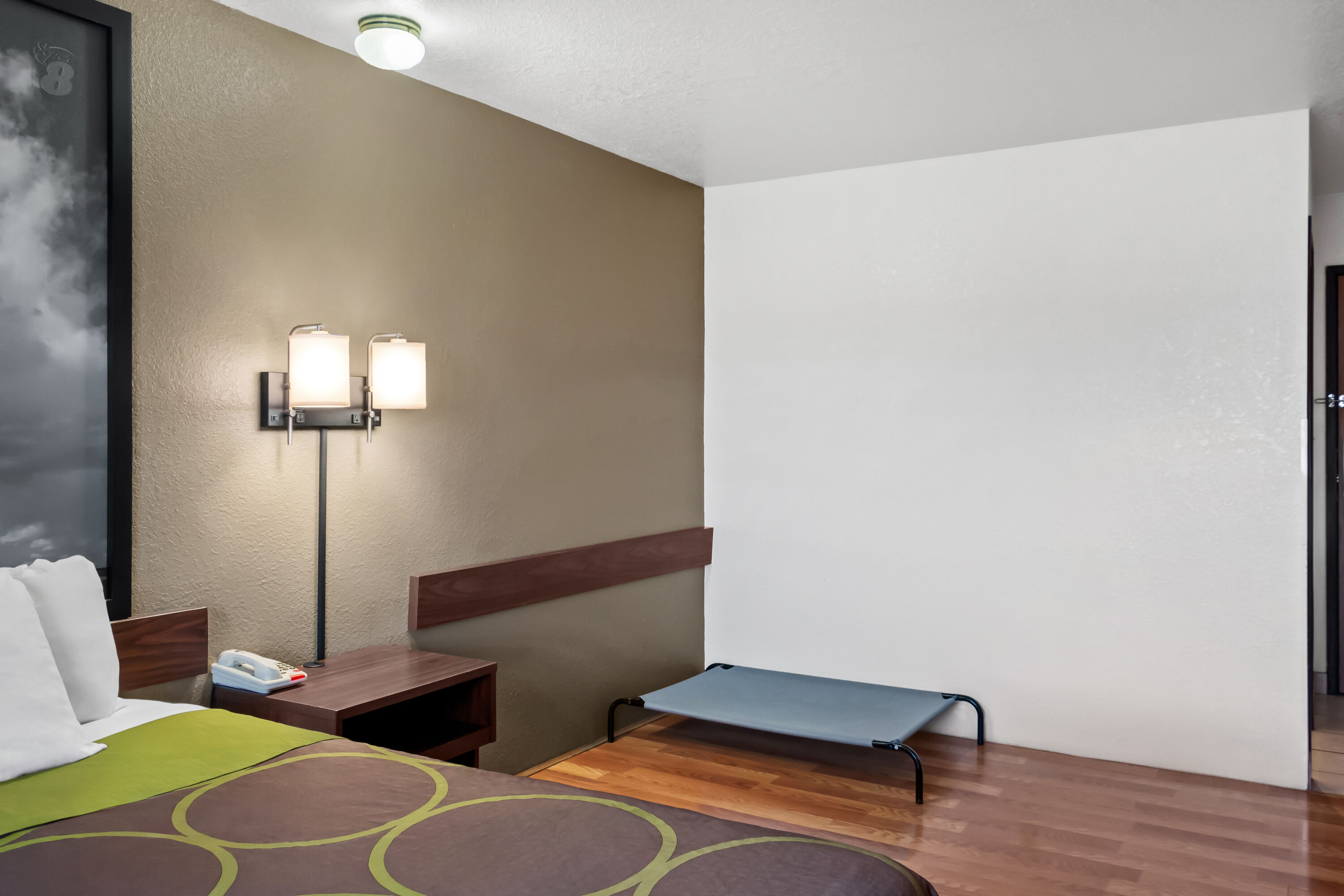 Queen bed guest room at the Super 8 by Wyndham Santa Rosa in Santa Rosa, New Mexico