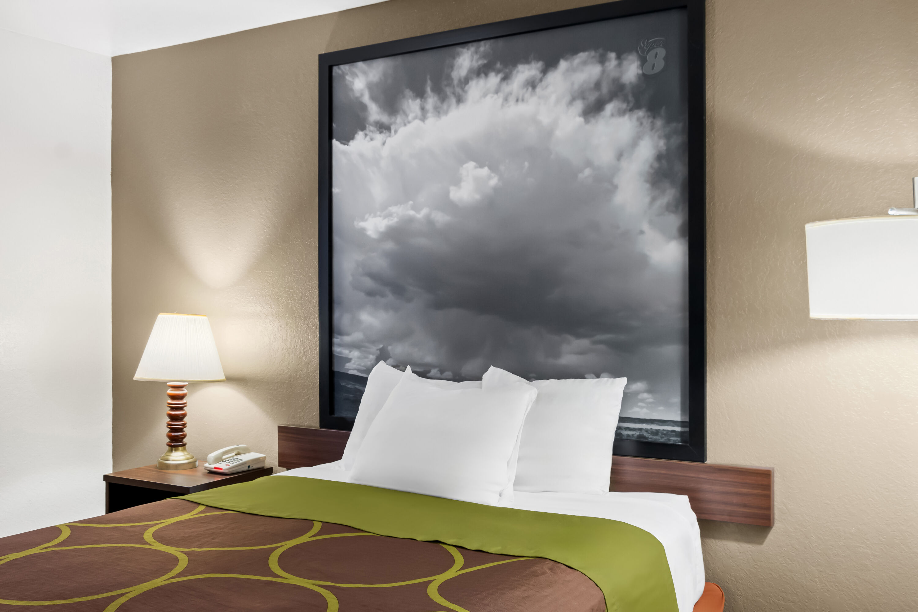 Queen bed guest room at the Super 8 by Wyndham Santa Rosa in Santa Rosa, New Mexico