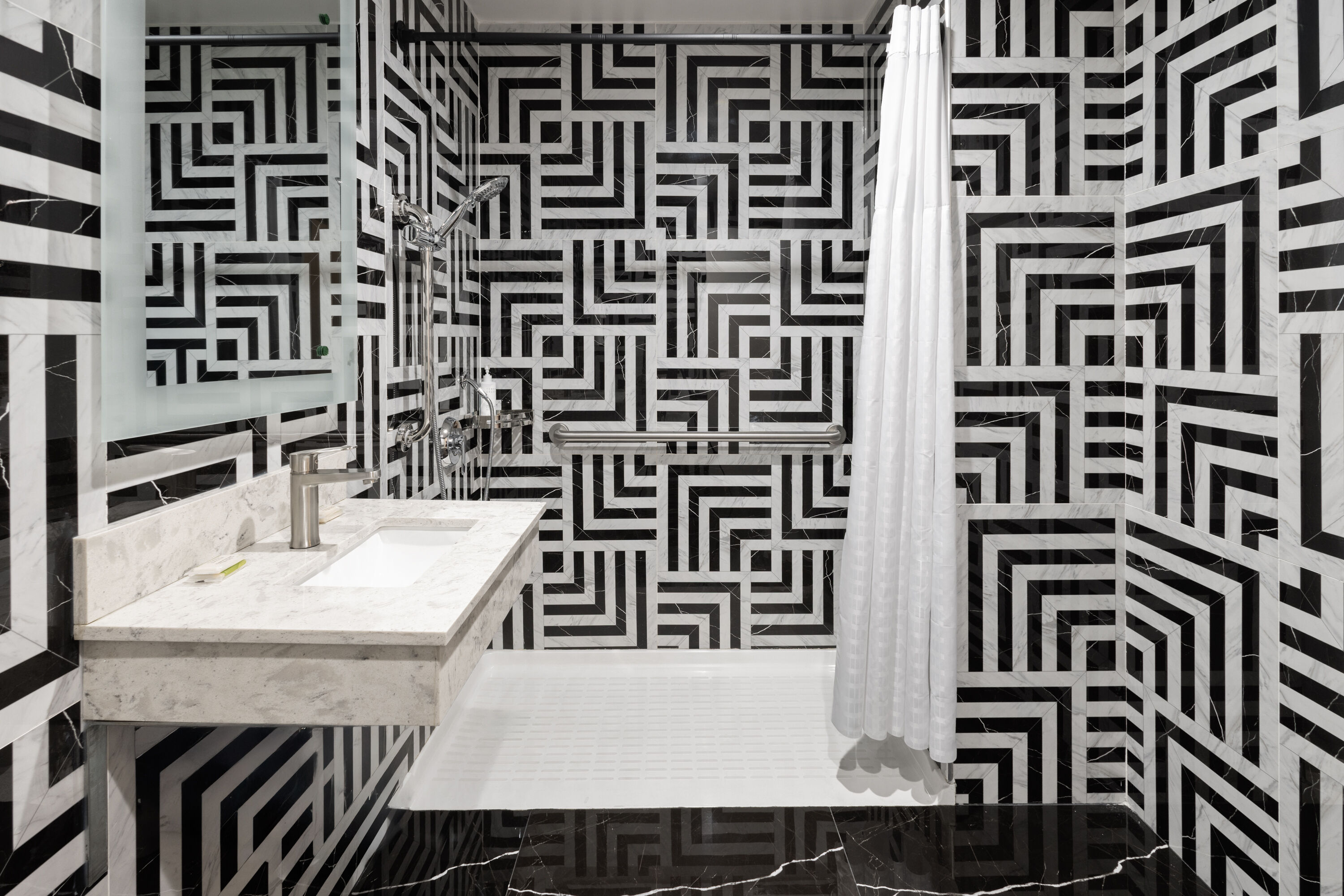 Guest room bath at the Super 8 by Wyndham Bronx Near Stadium in Bronx, New York