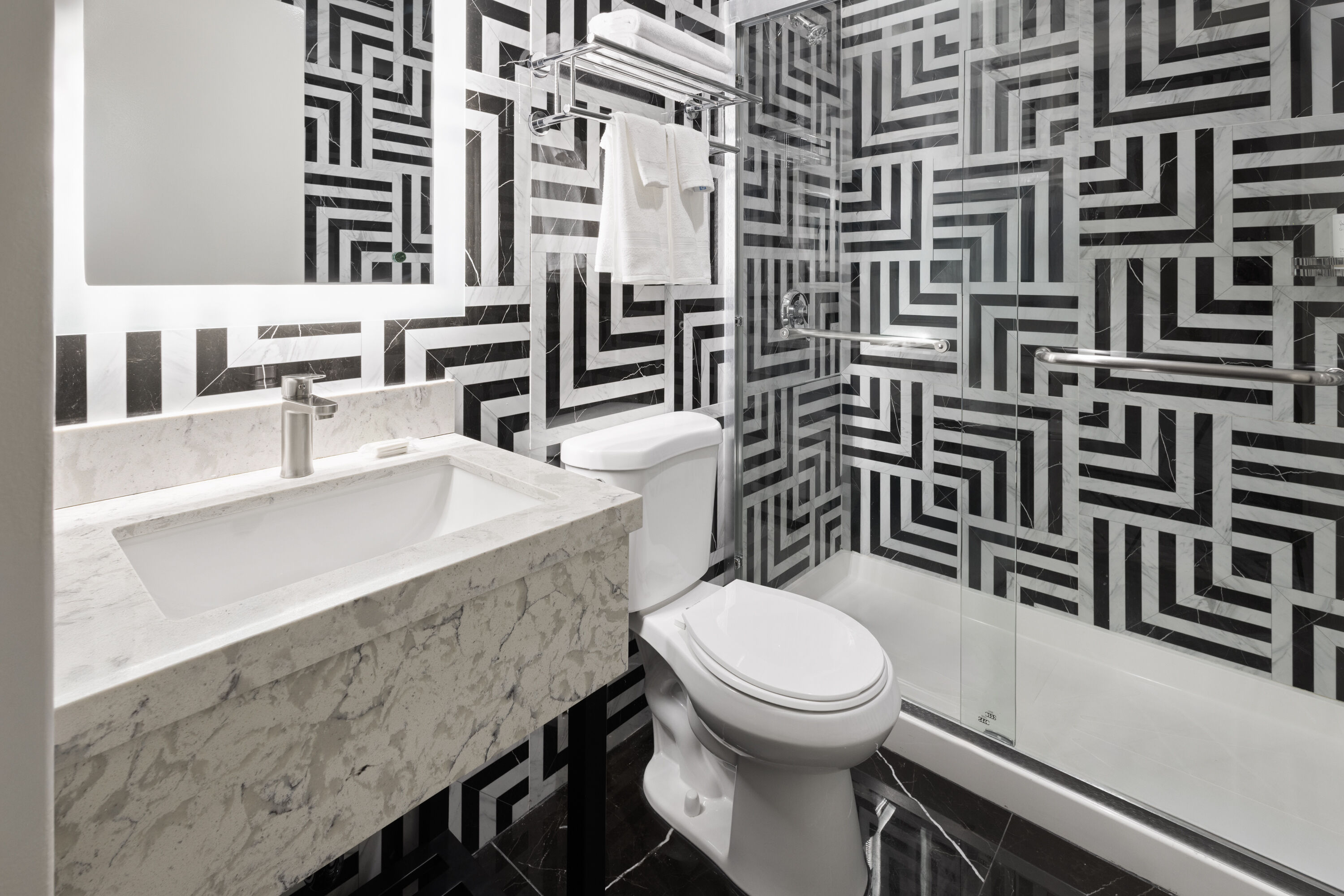 Guest room bath at the Super 8 by Wyndham Bronx Near Stadium in Bronx, New York