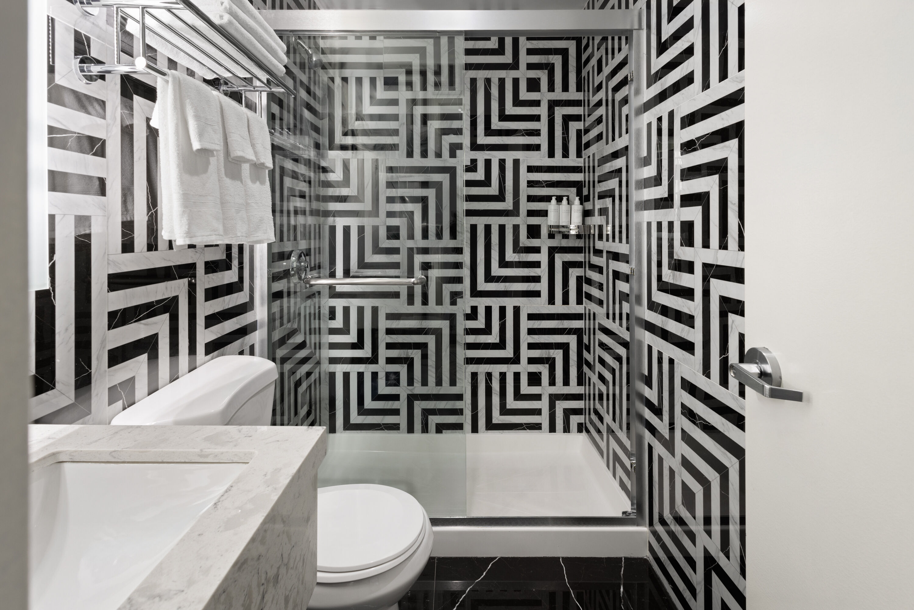 Guest room bath at the Super 8 by Wyndham Bronx Near Stadium in Bronx, New York