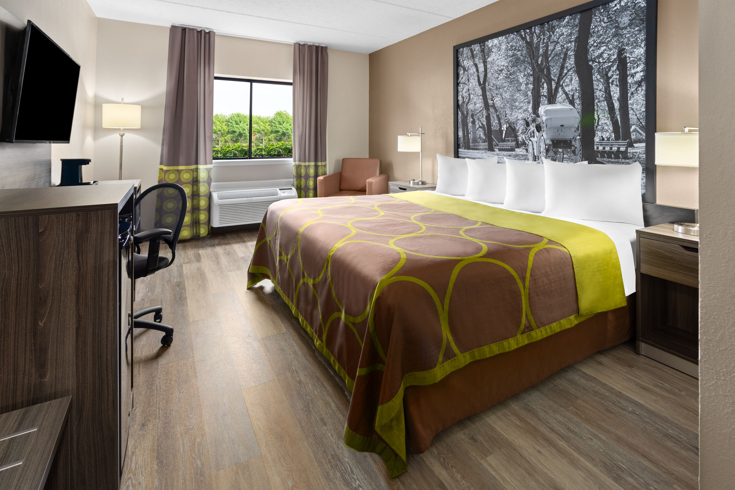 Guest room at the Super 8 by Wyndham Henrietta/Rochester Area in Henrietta, New York