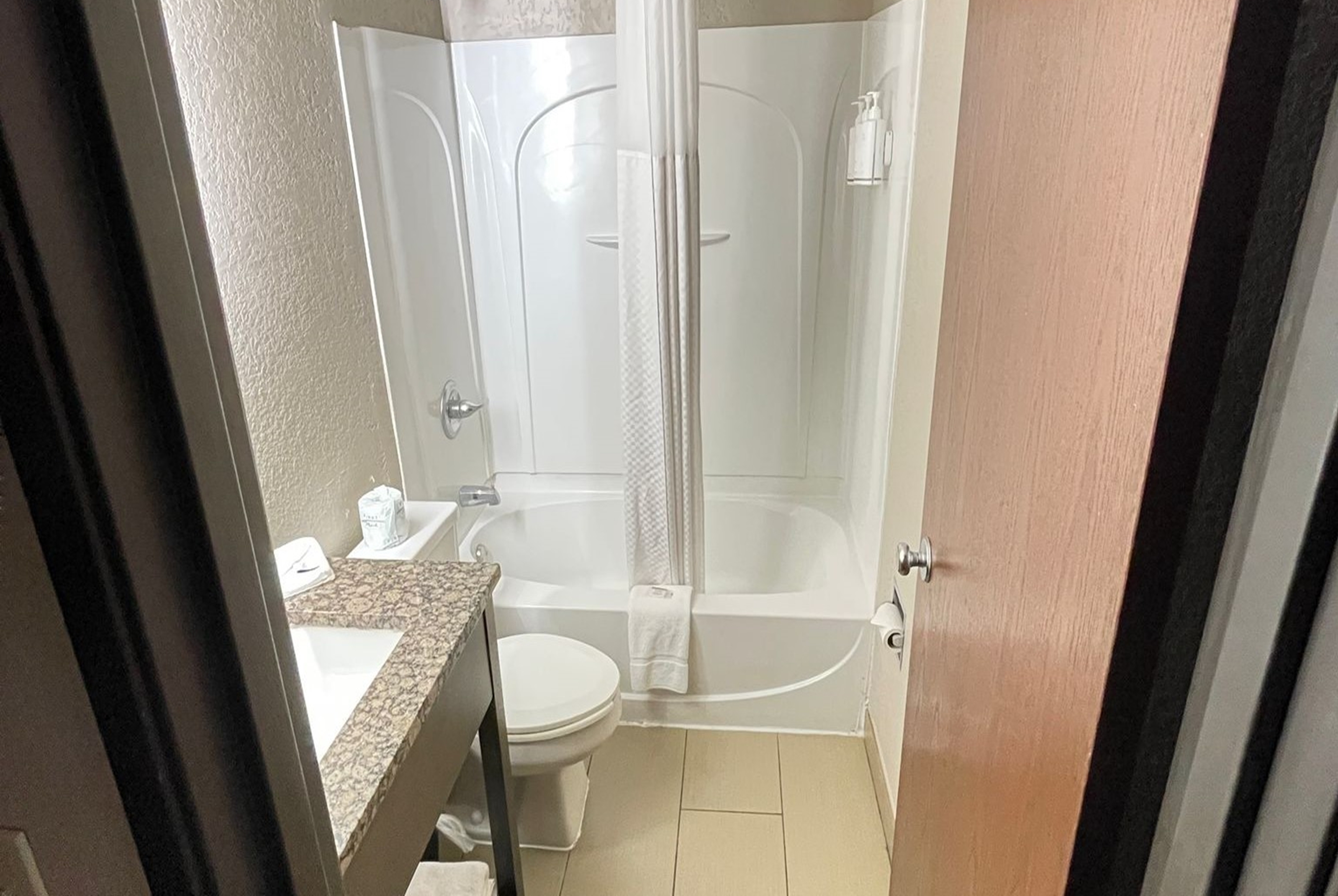 Guest room bath at the Super 8 by Wyndham Ithaca in Ithaca, New York