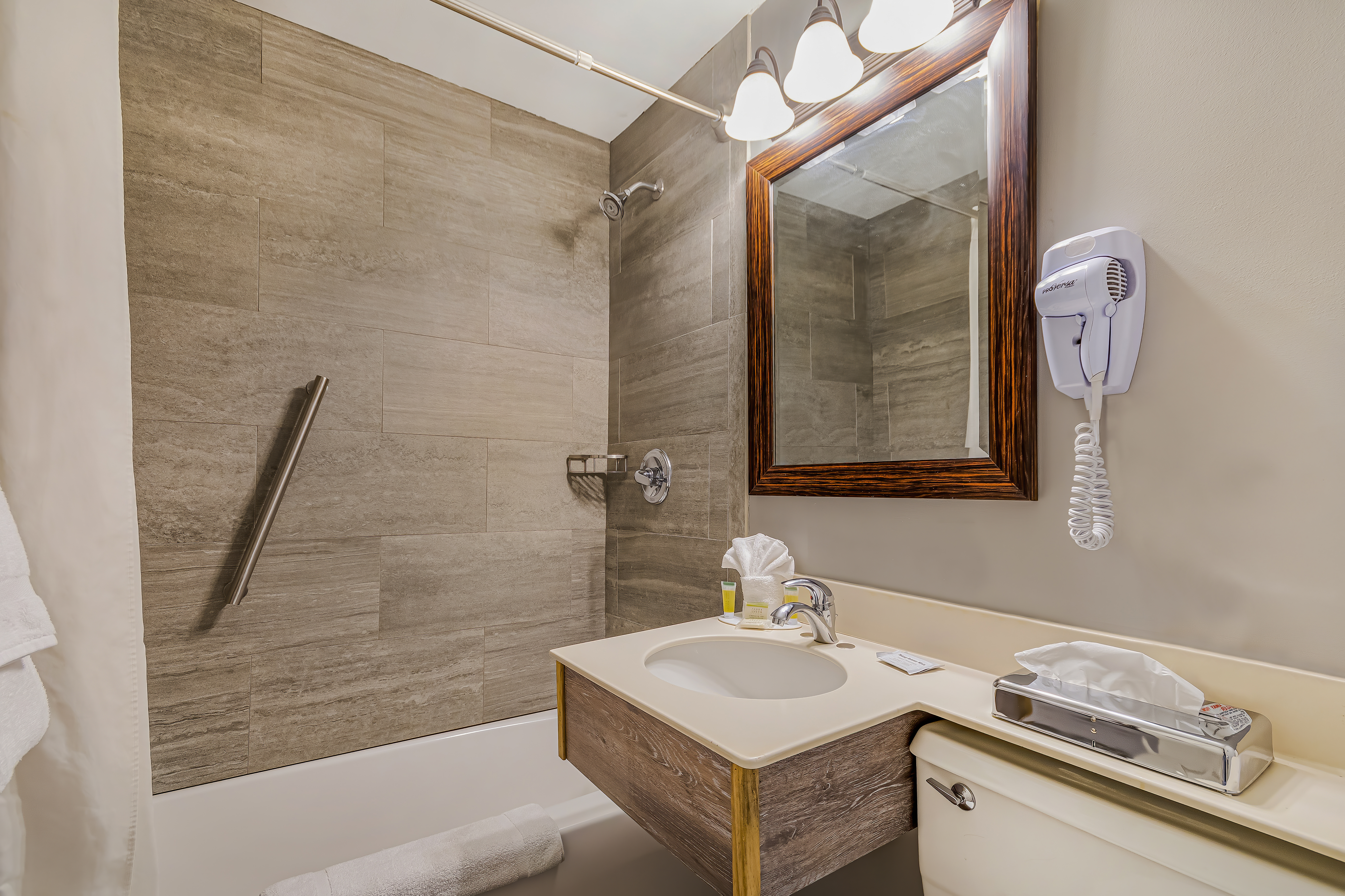 Guest room bath at the Super 8 by Wyndham Lake George/Downtown in Lake George, New York