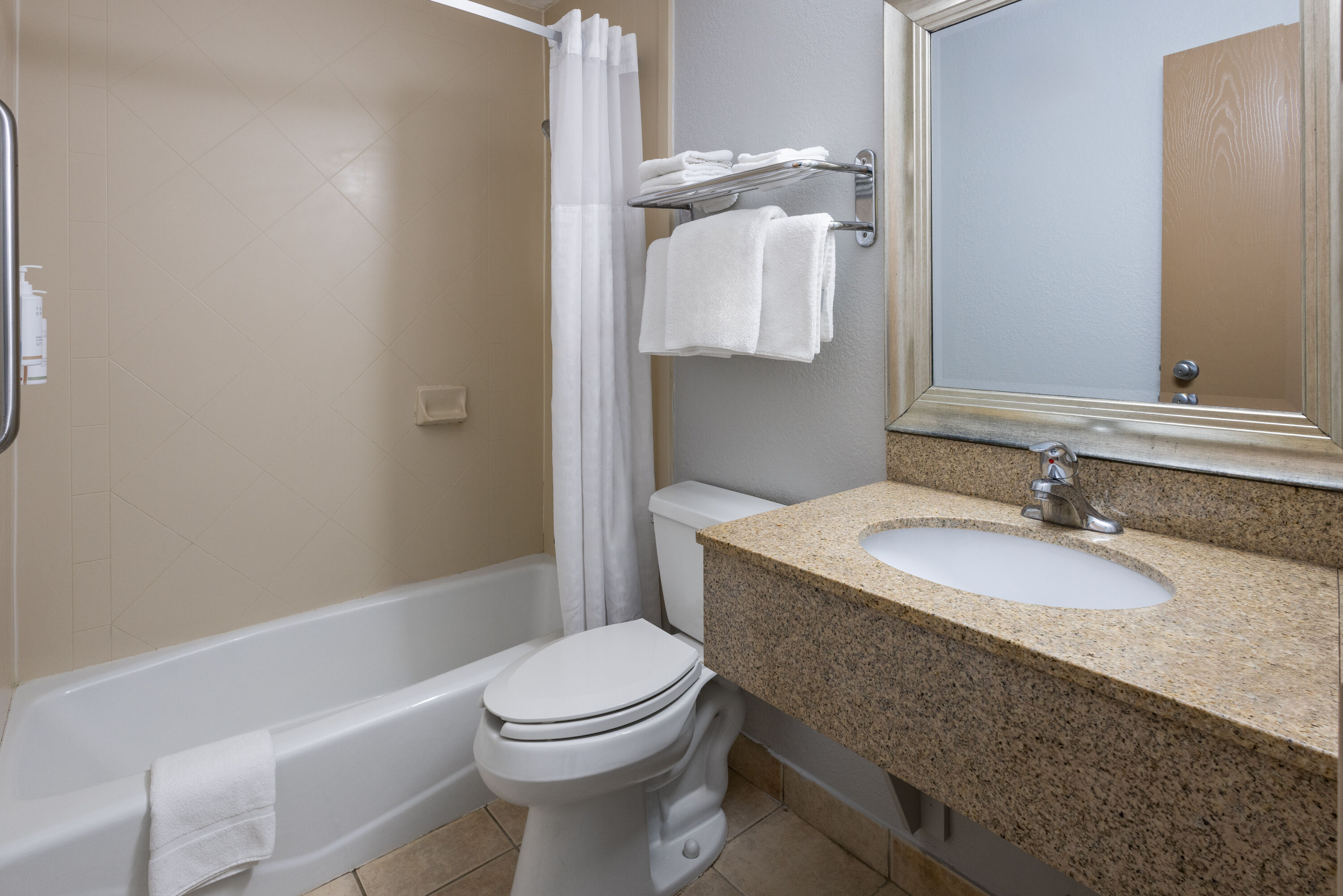 Guest room bath at the Super 8 by Wyndham Latham/Albany Airport in Latham, New York