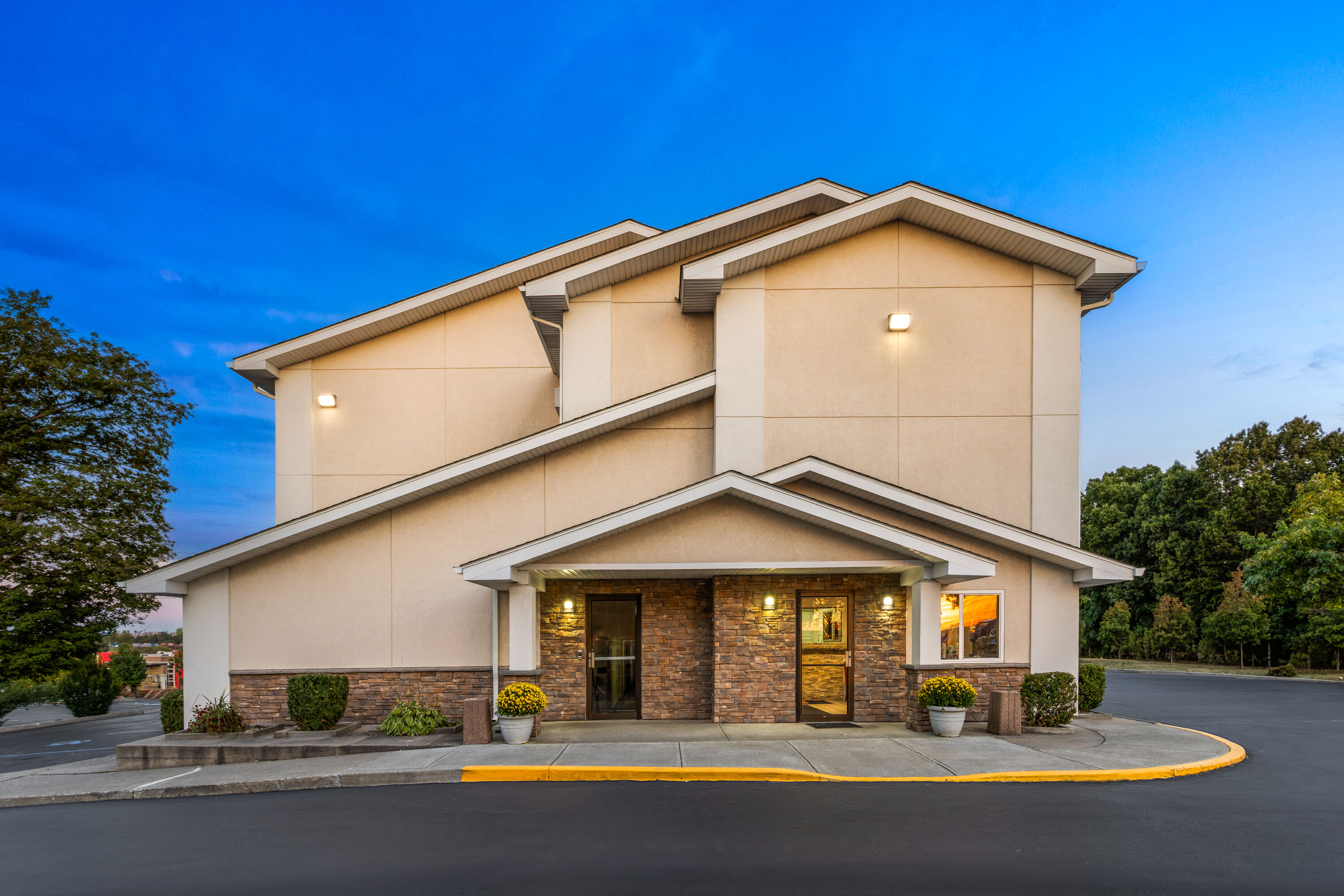 Exterior Dusk Image of Super 8 by Wyndham Latham/Albany Airport hotel in Latham, New York