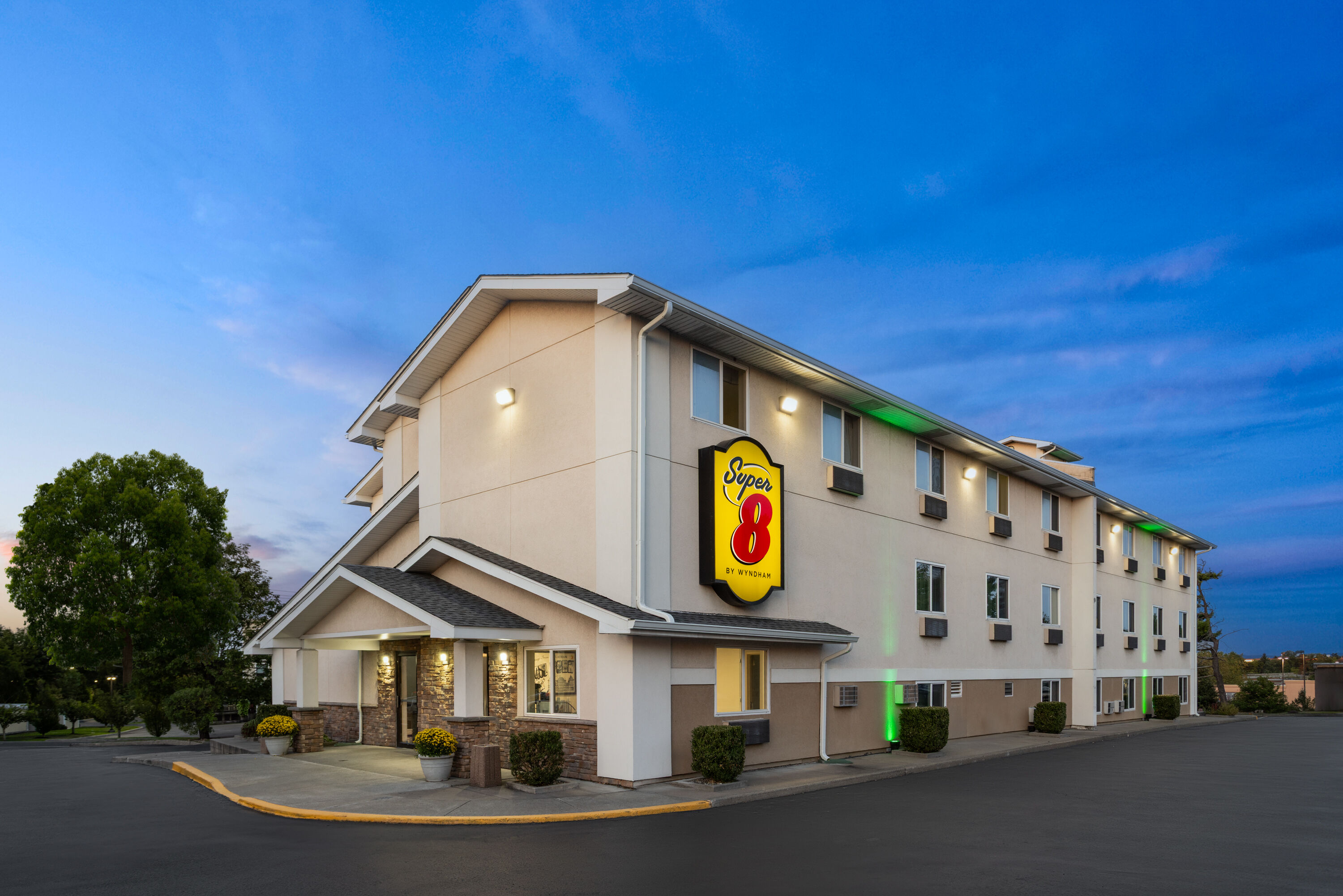 Exterior Dusk Image of Super 8 by Wyndham Latham/Albany Airport hotel in Latham, New York