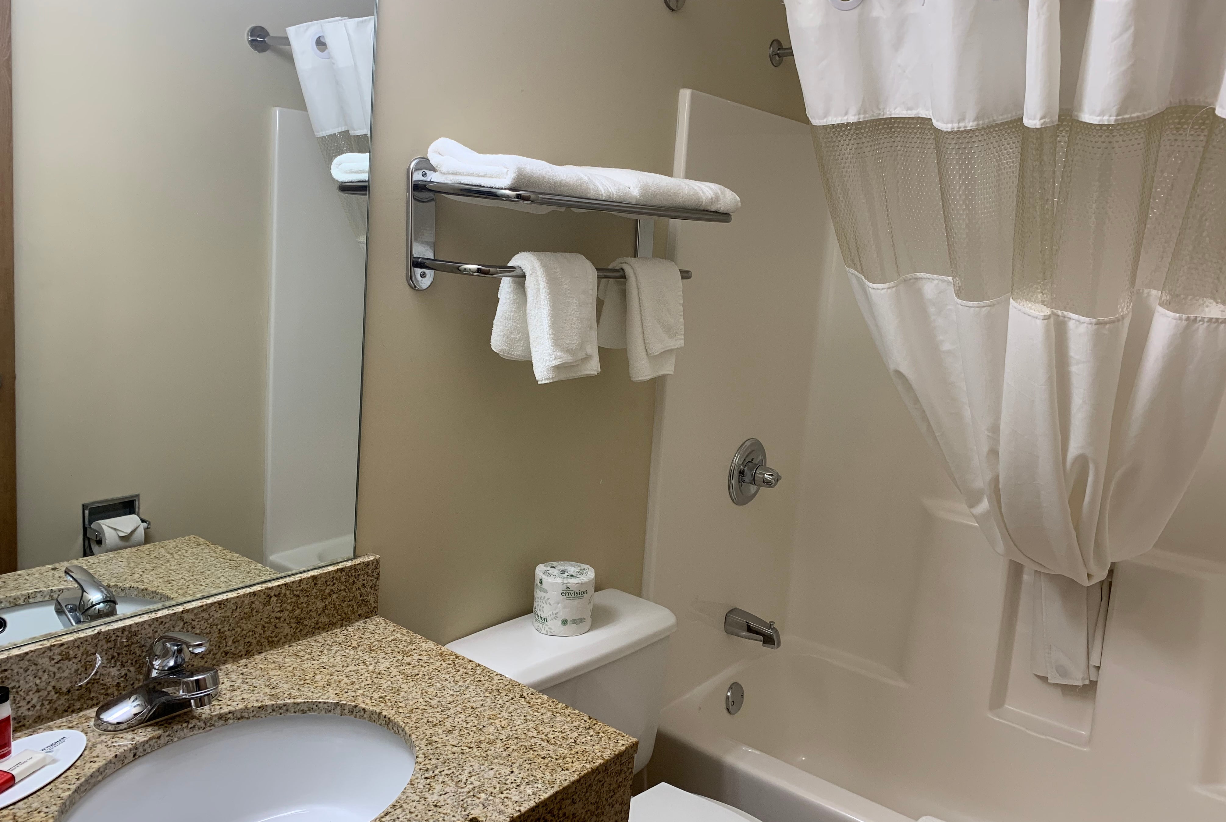 Guest room bath at the Super 8 by Wyndham Liverpool/Clay/Syracuse Area in Liverpool, New York