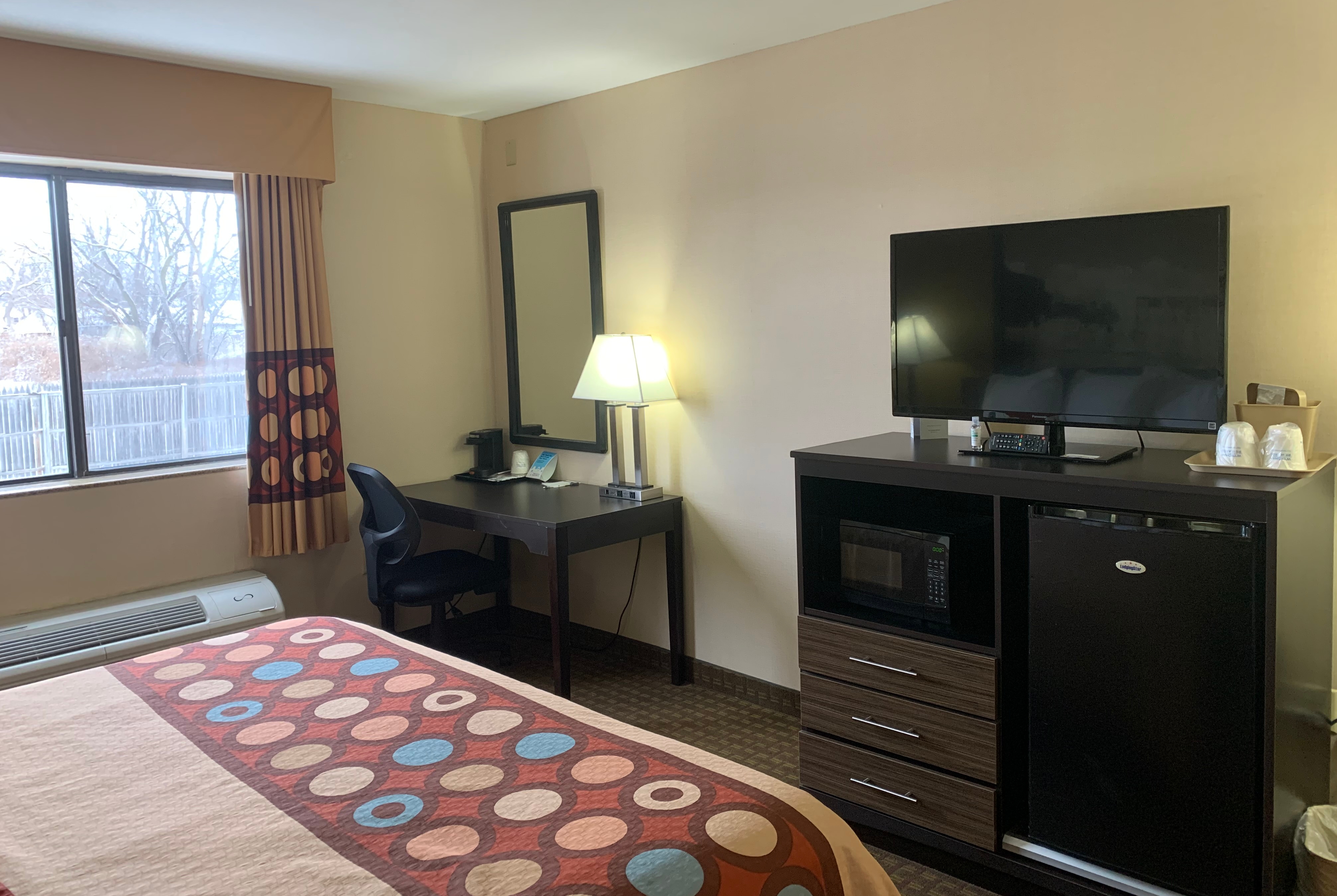 Guest room at the Super 8 by Wyndham Liverpool/Clay/Syracuse Area in Liverpool, New York