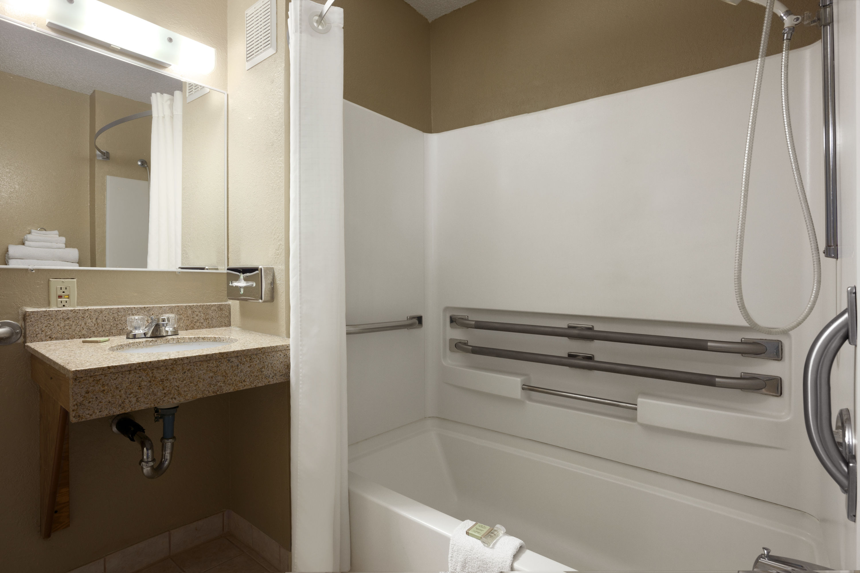 Guest room bath at the Super 8 by Wyndham Pulaski in Pulaski, New York