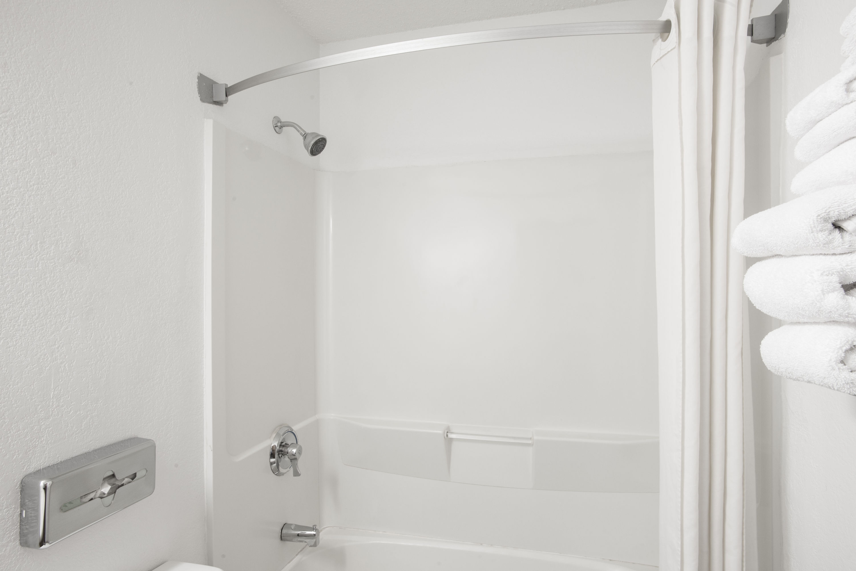 Guest room bath at the Super 8 by Wyndham Ticonderoga in Ticonderoga, New York