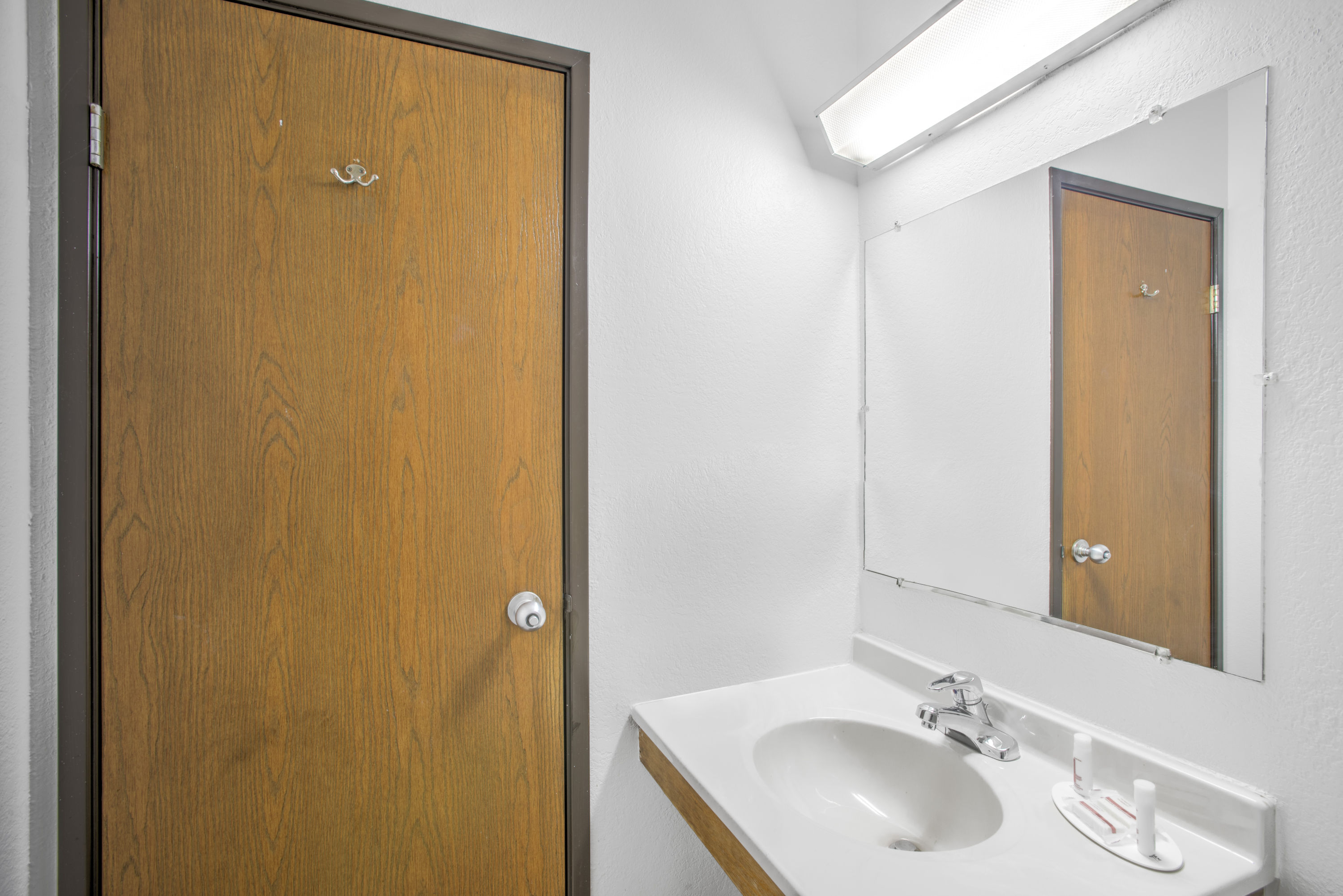 Guest room bath at the Super 8 by Wyndham Ticonderoga in Ticonderoga, New York