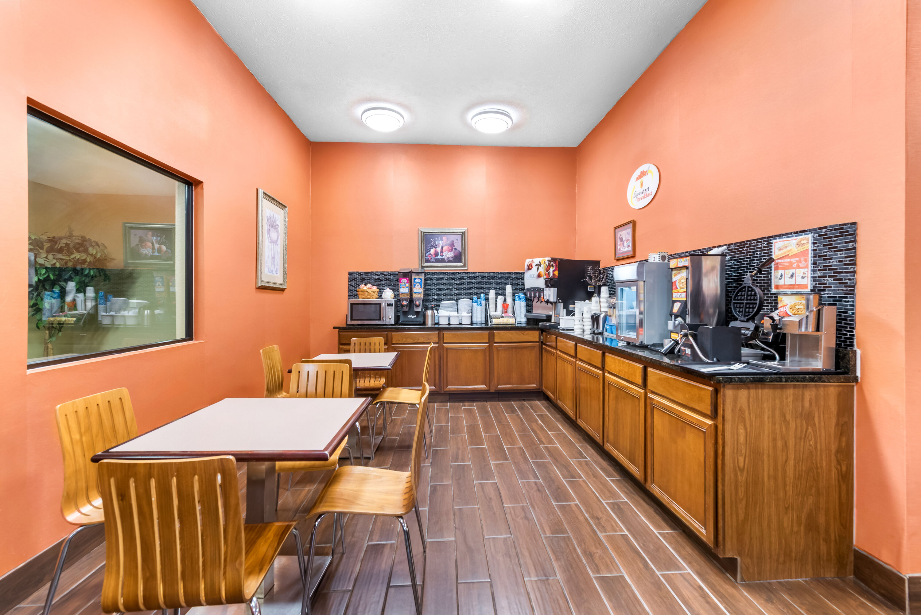 Super 8 by Wyndham Bellefontaine restaurant breakfast area with seating in Bellefontaine, Ohio