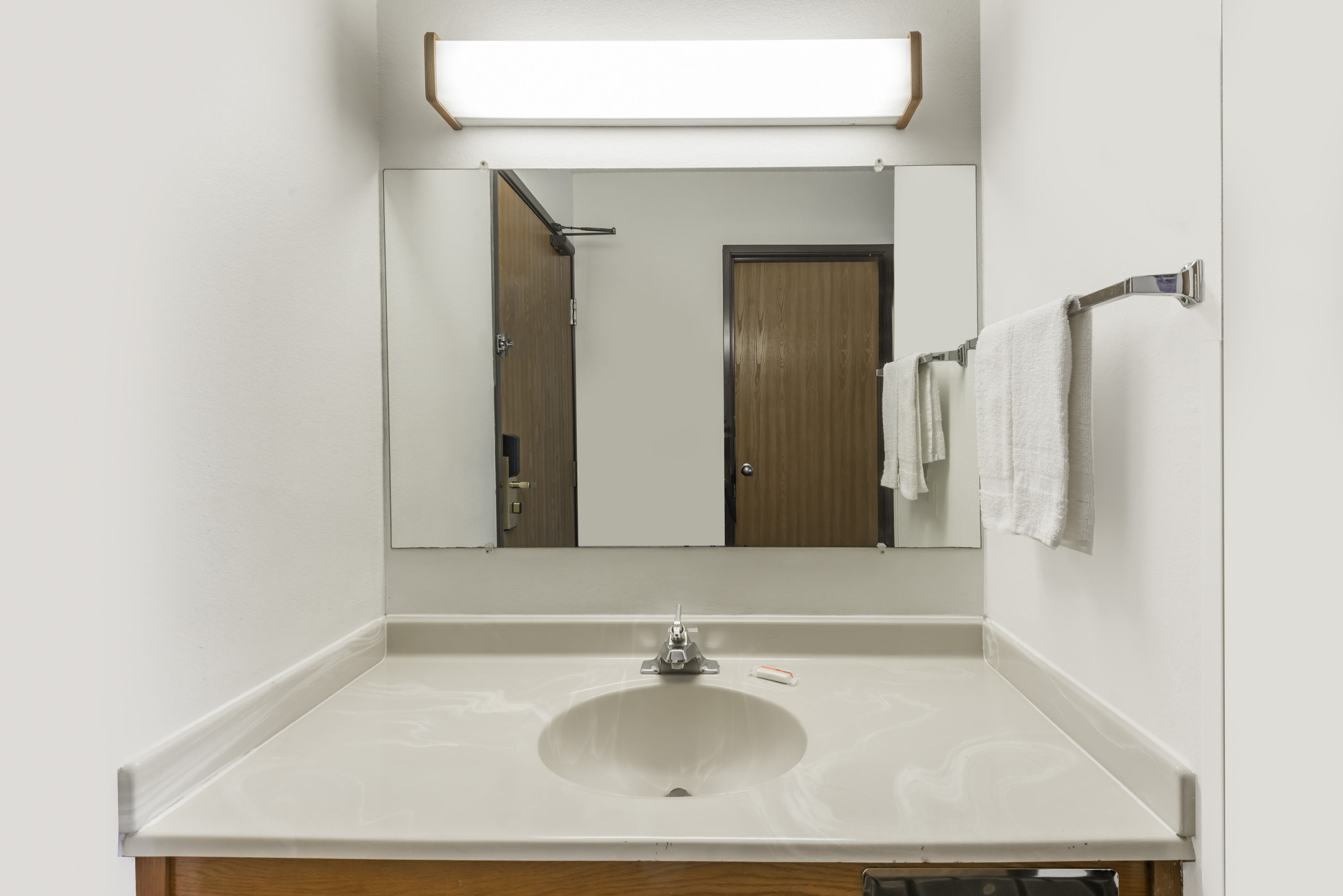 Guest room bath at the Super 8 by Wyndham Coshocton Roscoe Village in Coshocton, Ohio