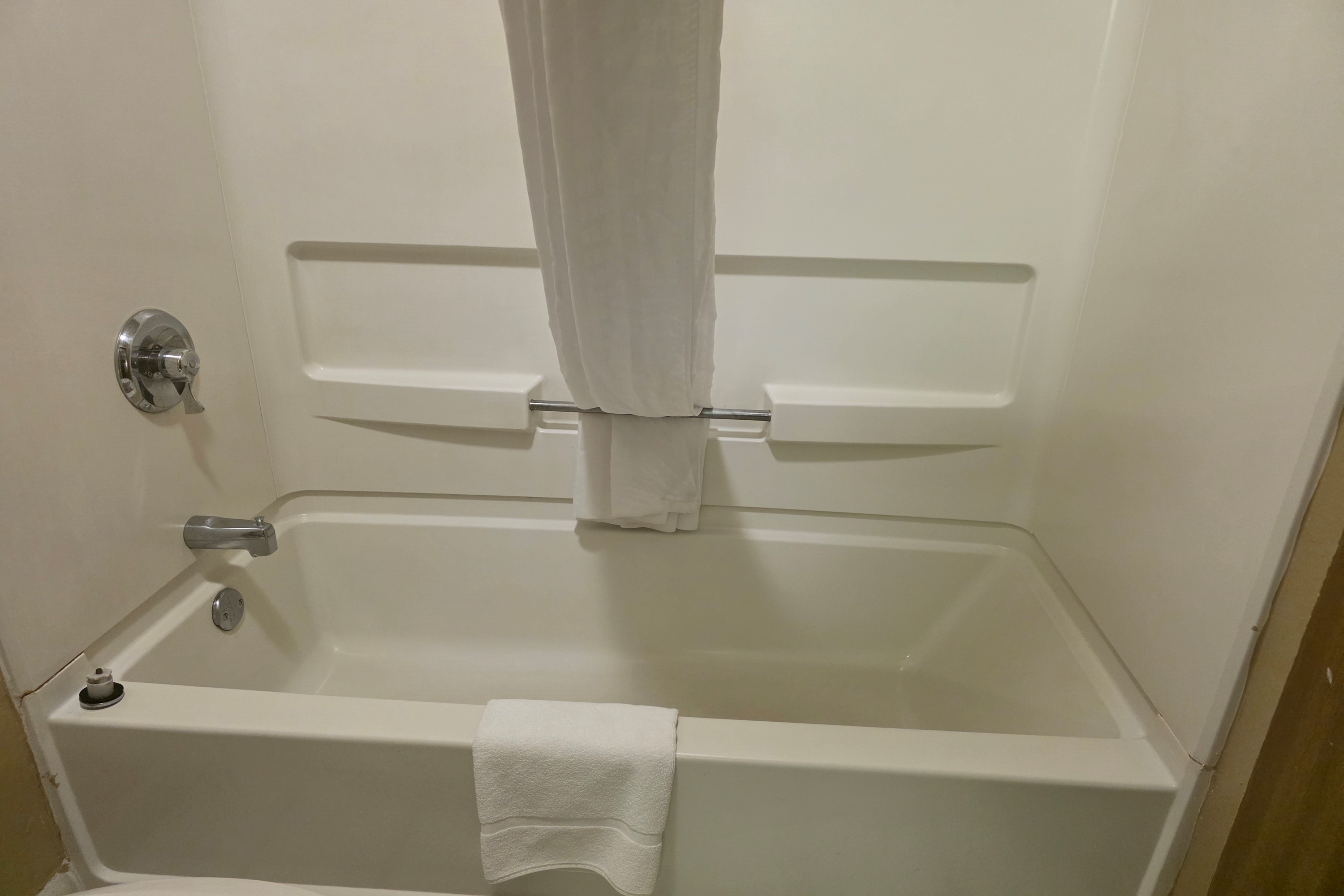 Guest room bath at the Super 8 by Wyndham Coshocton Roscoe Village in Coshocton, Ohio