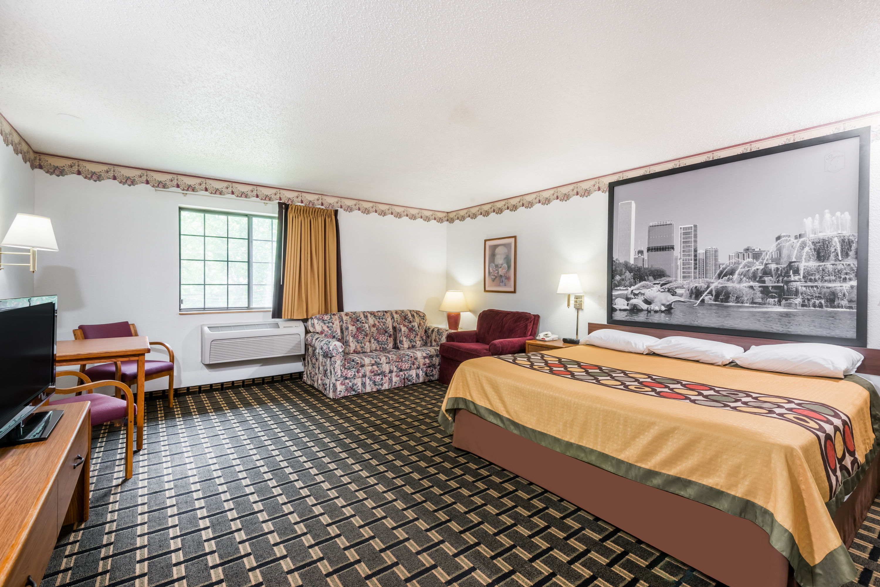 Guest room at the Super 8 by Wyndham Coshocton Roscoe Village in Coshocton, Ohio