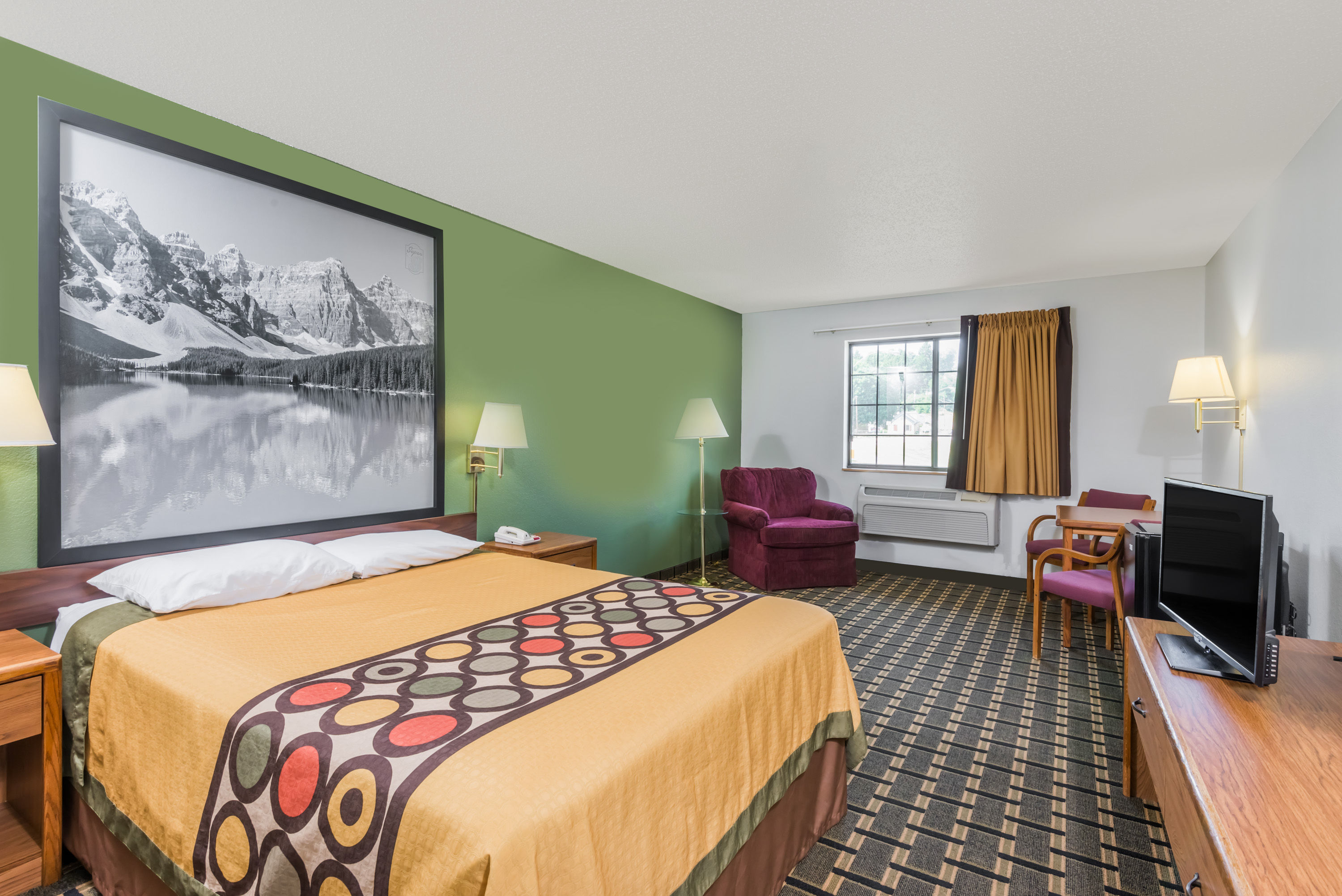 Guest room at the Super 8 by Wyndham Coshocton Roscoe Village in Coshocton, Ohio