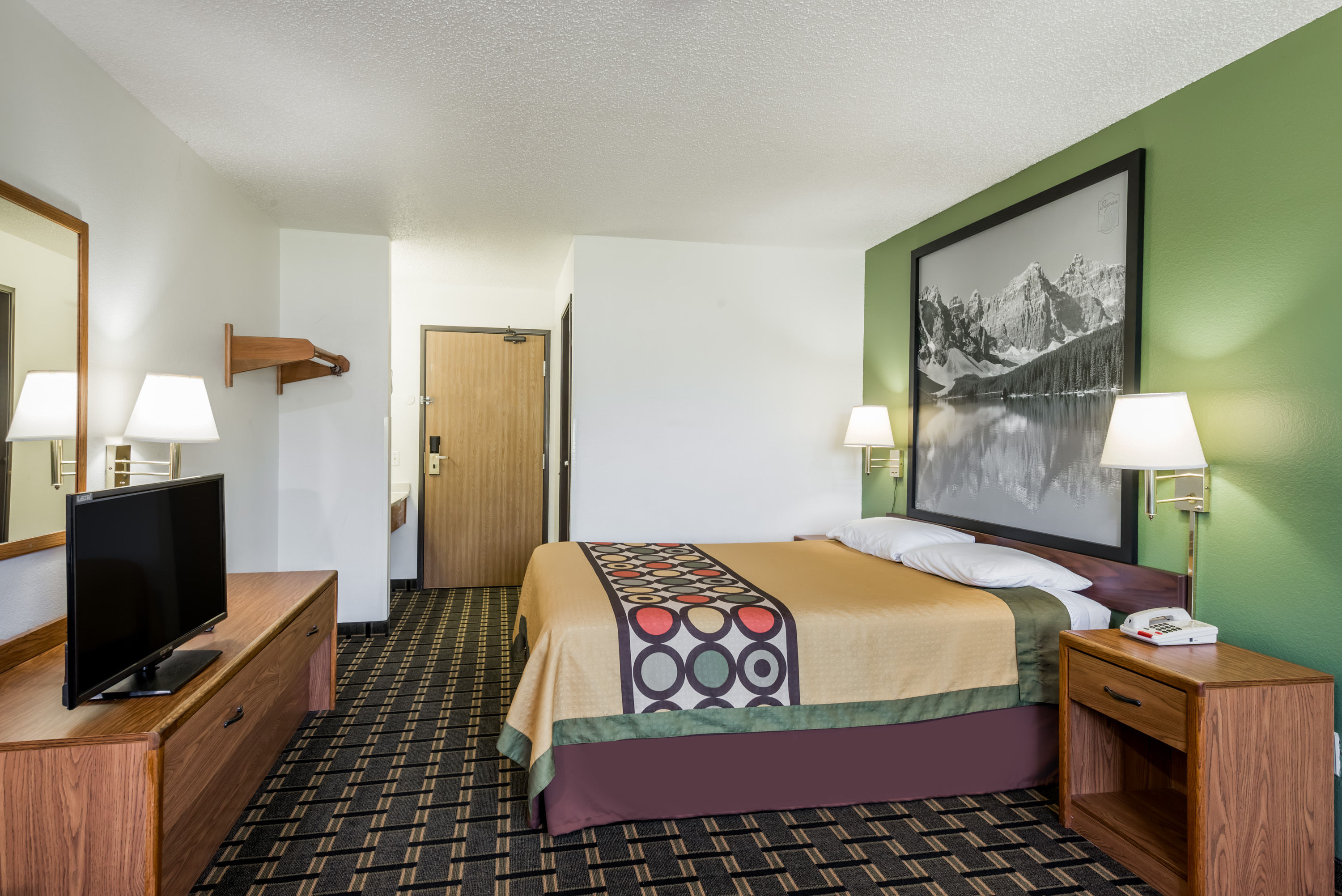 Guest room at the Super 8 by Wyndham Coshocton Roscoe Village in Coshocton, Ohio