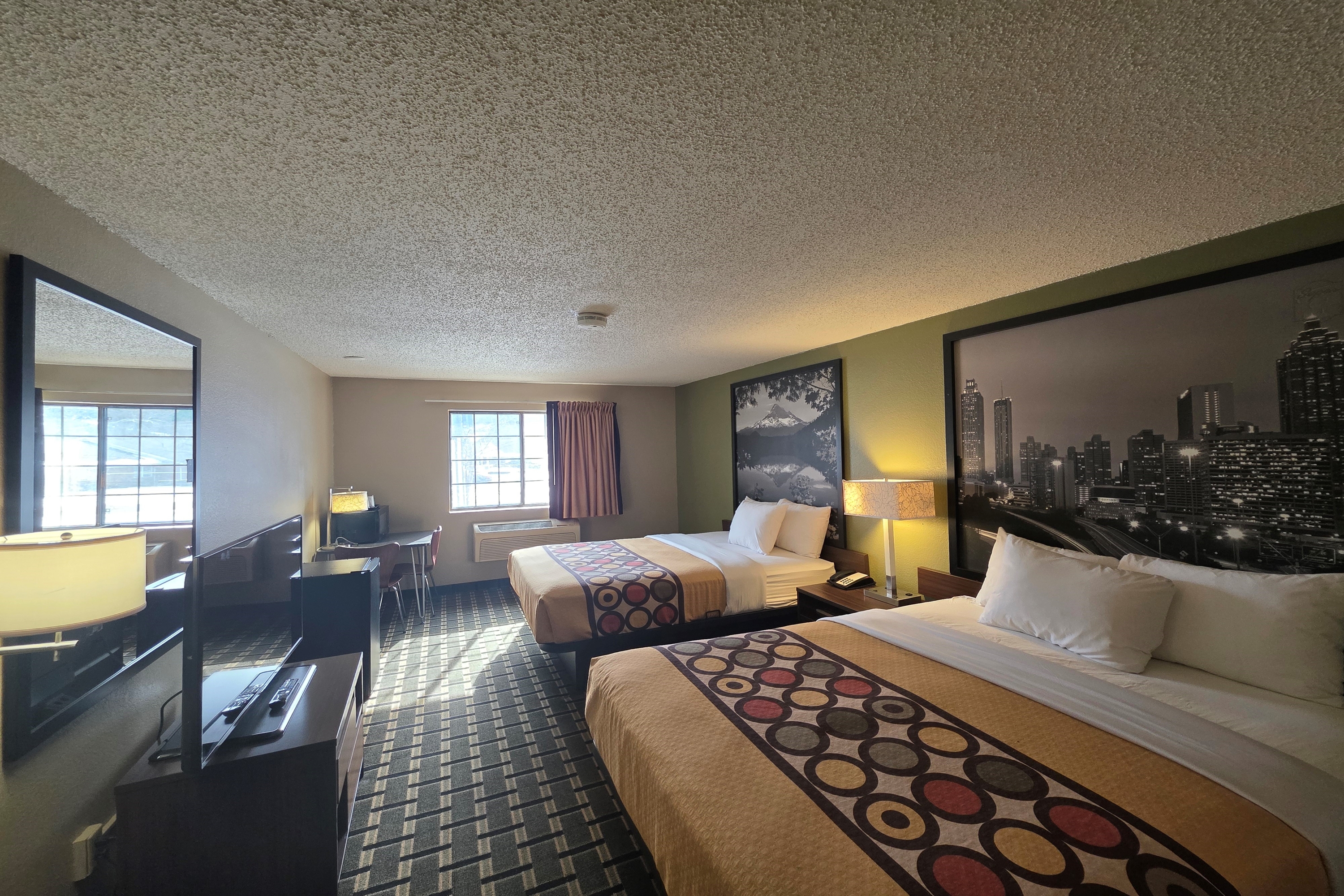 Guest room at the Super 8 by Wyndham Coshocton Roscoe Village in Coshocton, Ohio