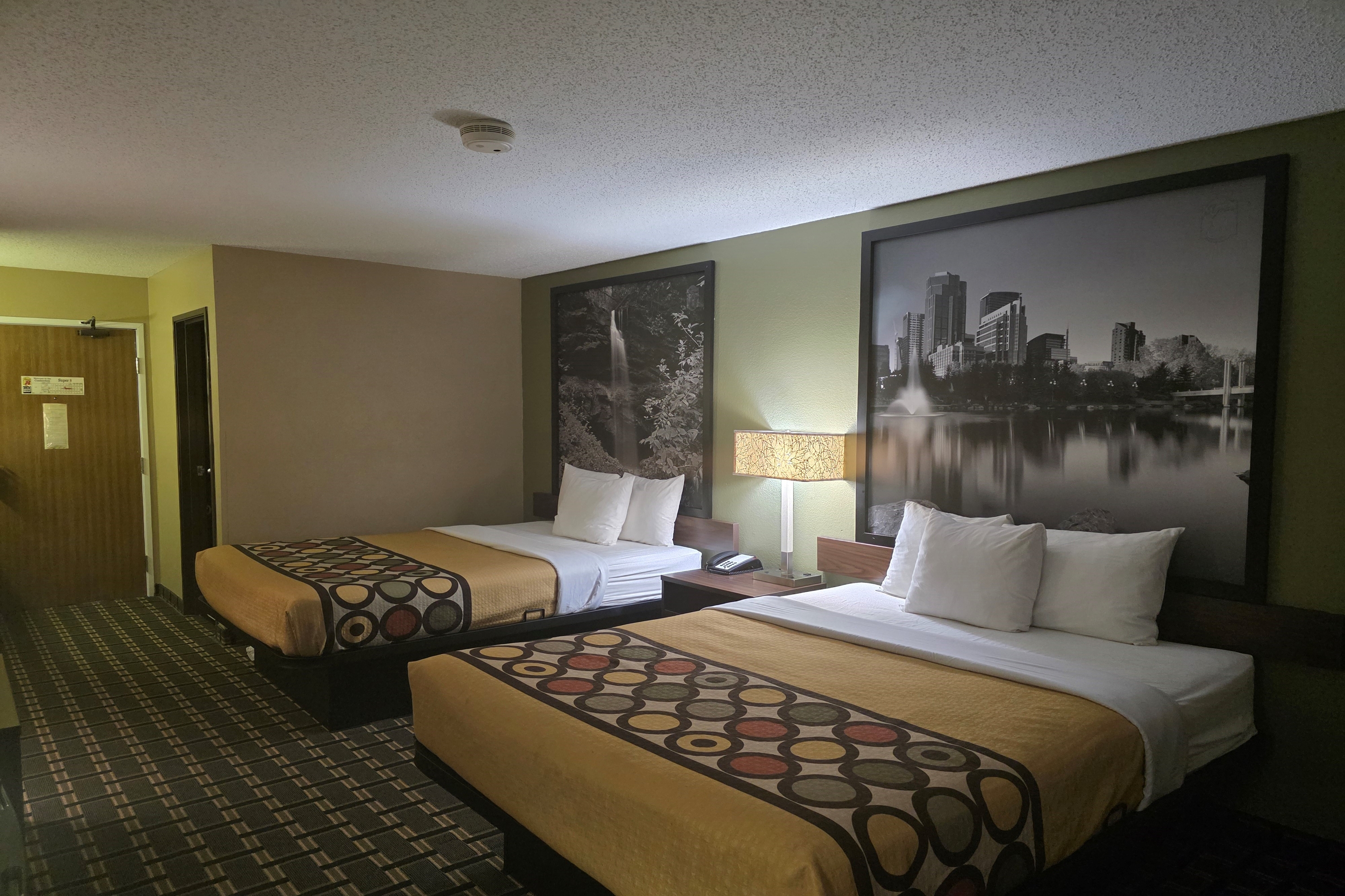 Guest room at the Super 8 by Wyndham Coshocton Roscoe Village in Coshocton, Ohio