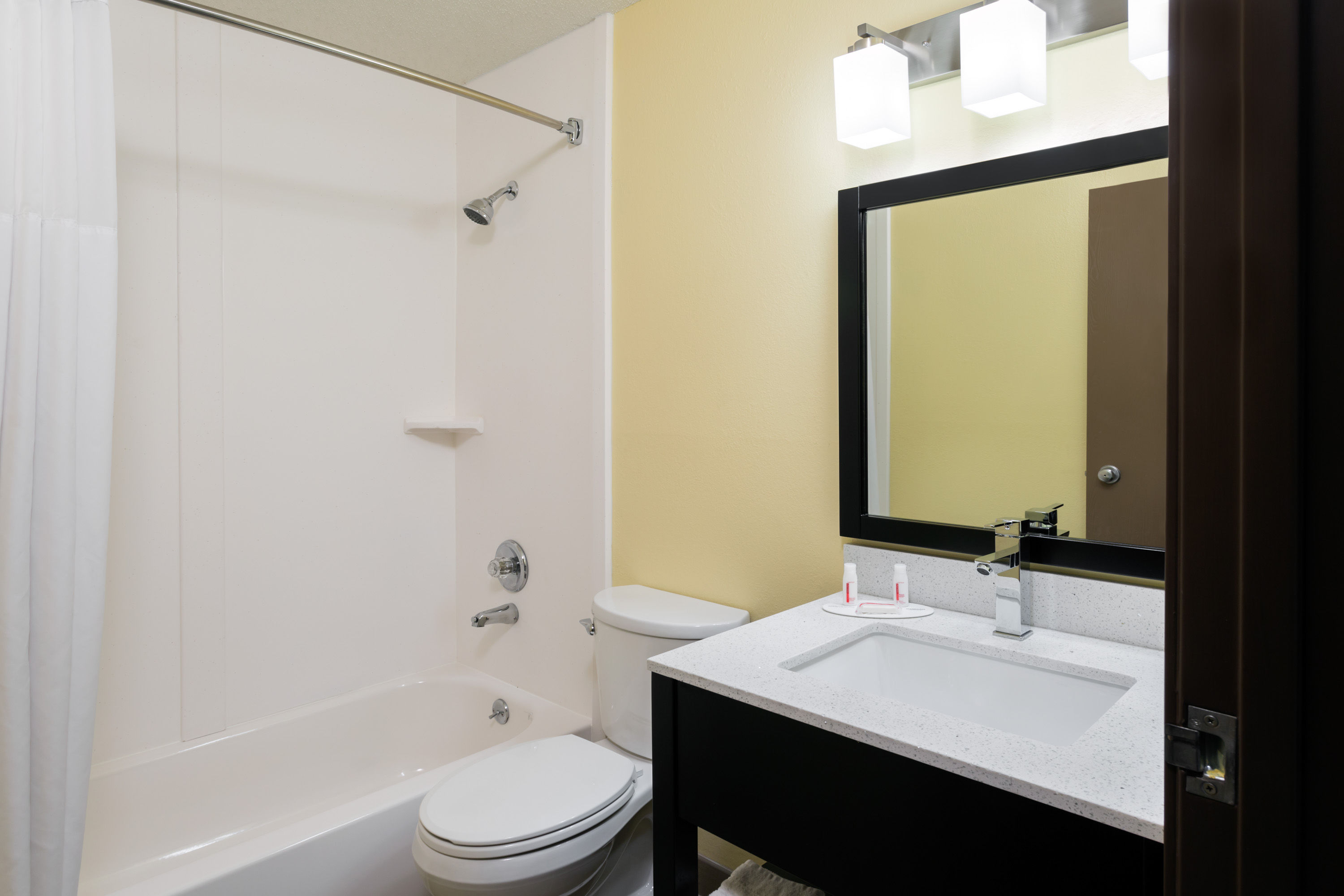 Guest room bath at the Super 8 by Wyndham Marietta in Marietta, Ohio