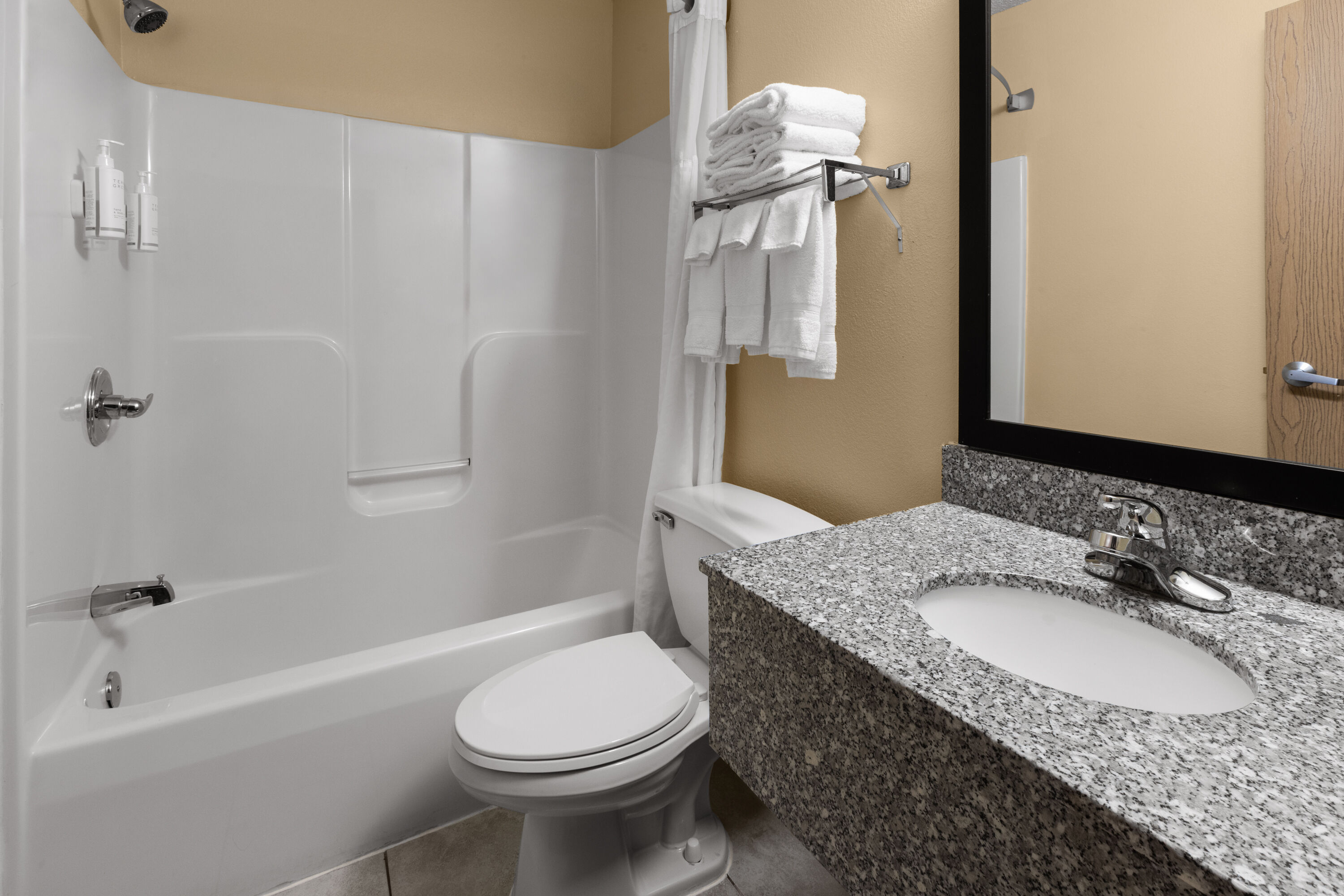 Guest room bath at the Super 8 by Wyndham Medina in Medina, Ohio