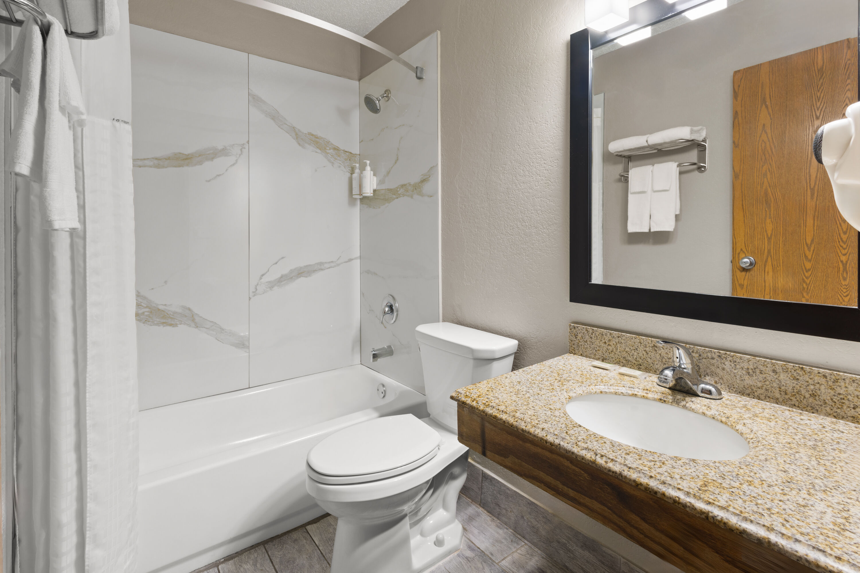 Guest room bath at the Super 8 by Wyndham Mentor/Cleveland Area in Mentor, Ohio