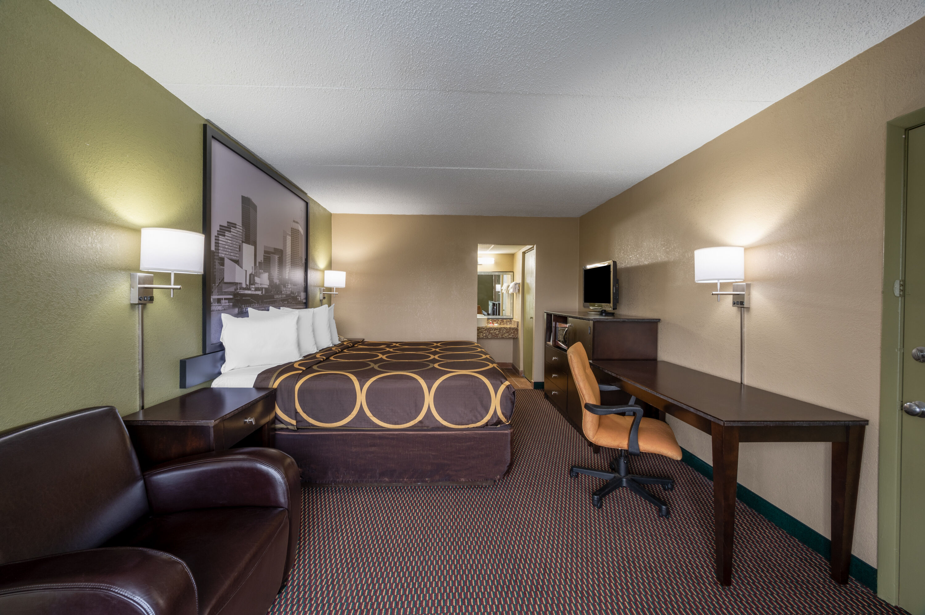 Guest room at the Super 8 by Wyndham Perrysburg/Toledo in Perrysburg, Ohio