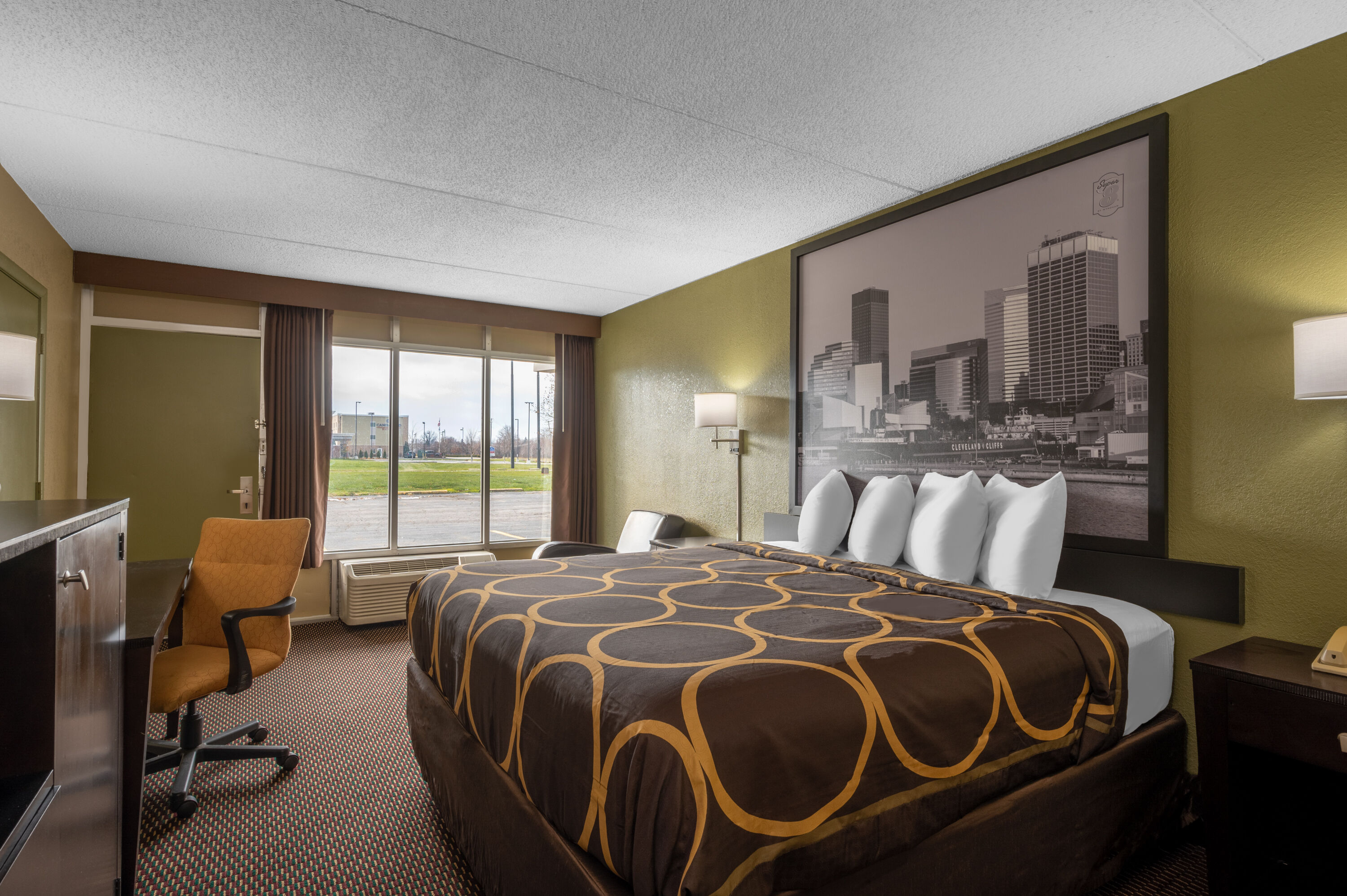 Guest room at the Super 8 by Wyndham Perrysburg/Toledo in Perrysburg, Ohio