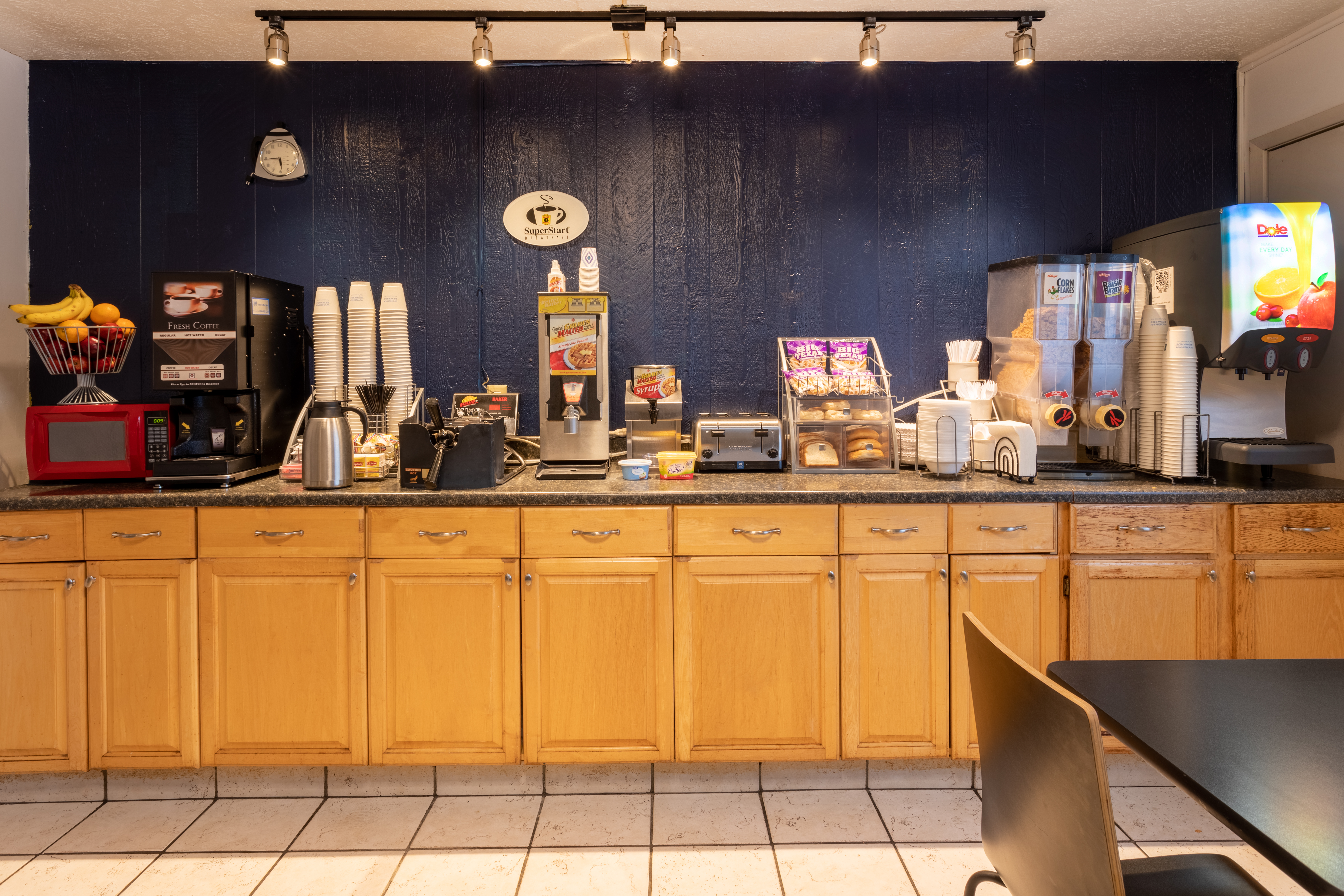 Super 8 by Wyndham Wooster restaurant breakfast area with seating in Wooster, Ohio