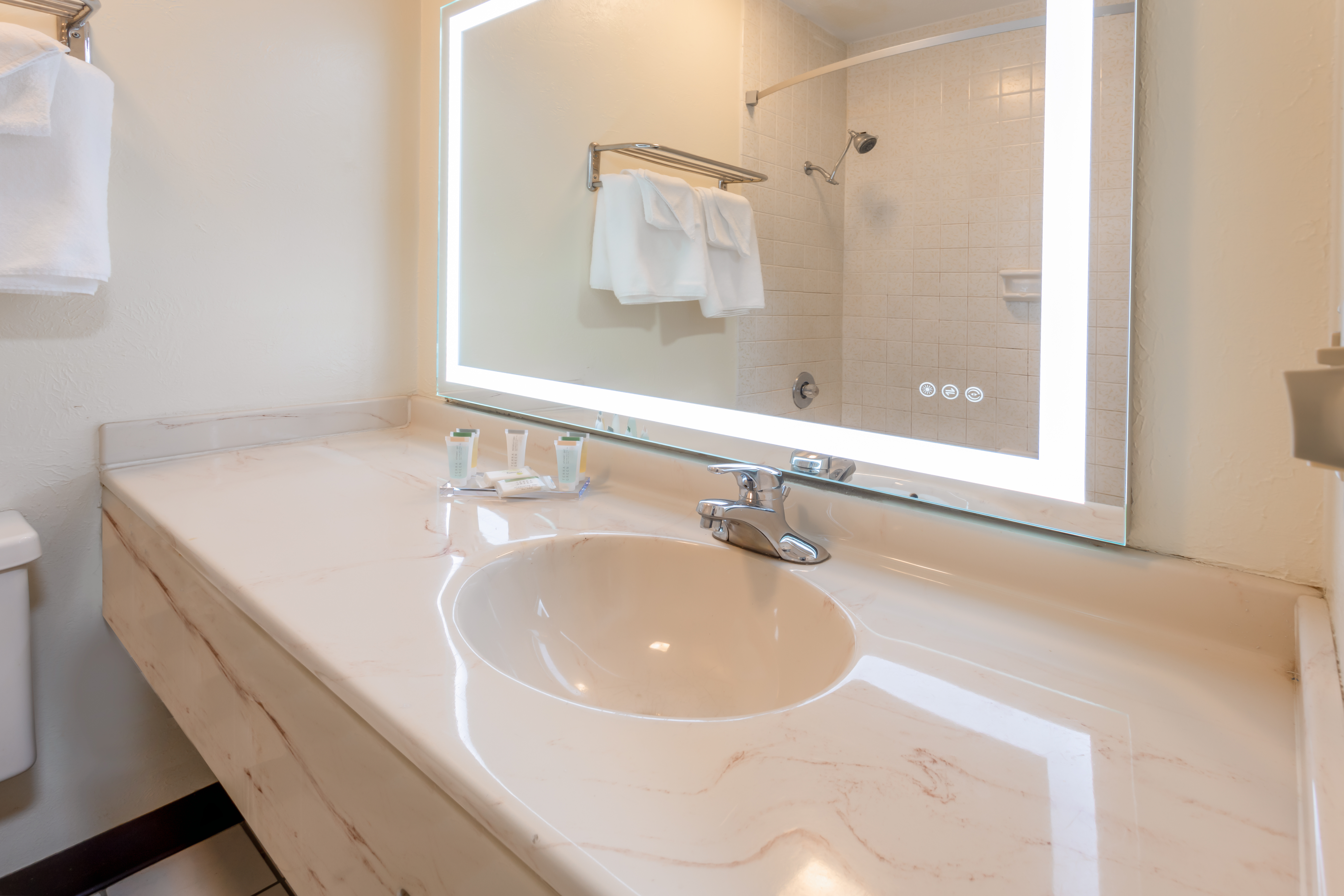 Guest room bath at the Super 8 by Wyndham Wooster in Wooster, Ohio