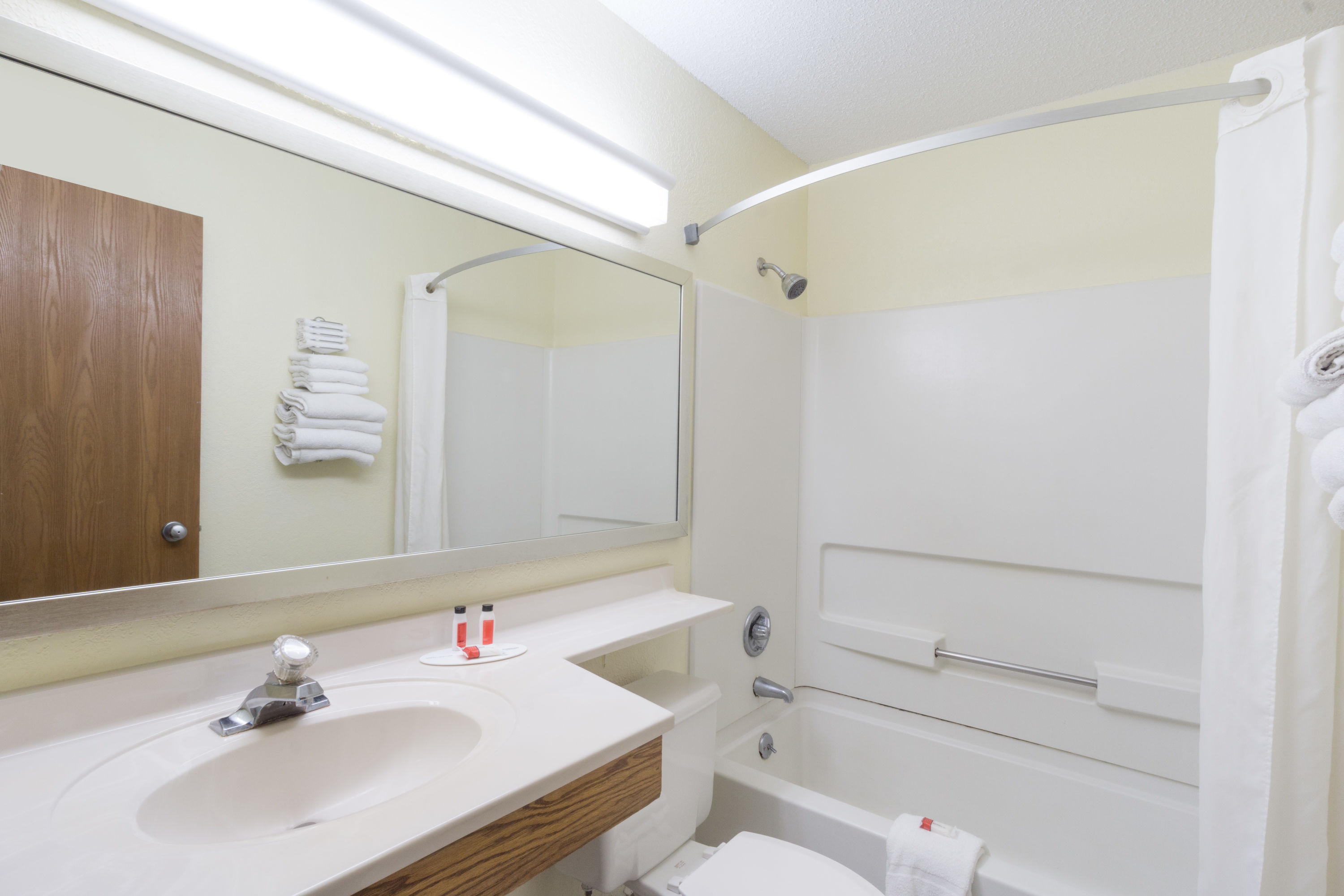 Guest room bath at the Super 8 by Wyndham Zanesville in Zanesville, Ohio