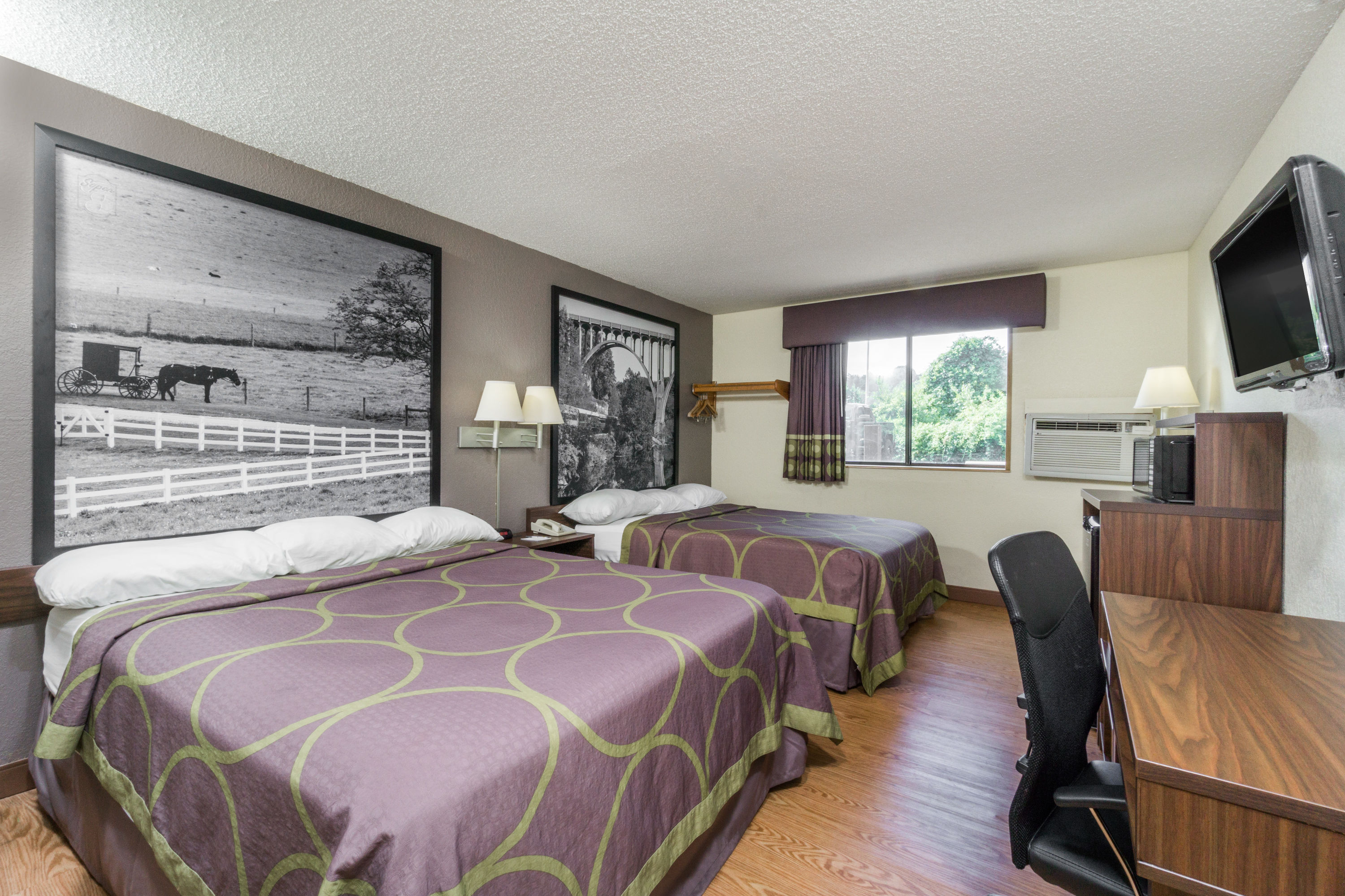 Guest room at the Super 8 by Wyndham Zanesville in Zanesville, Ohio