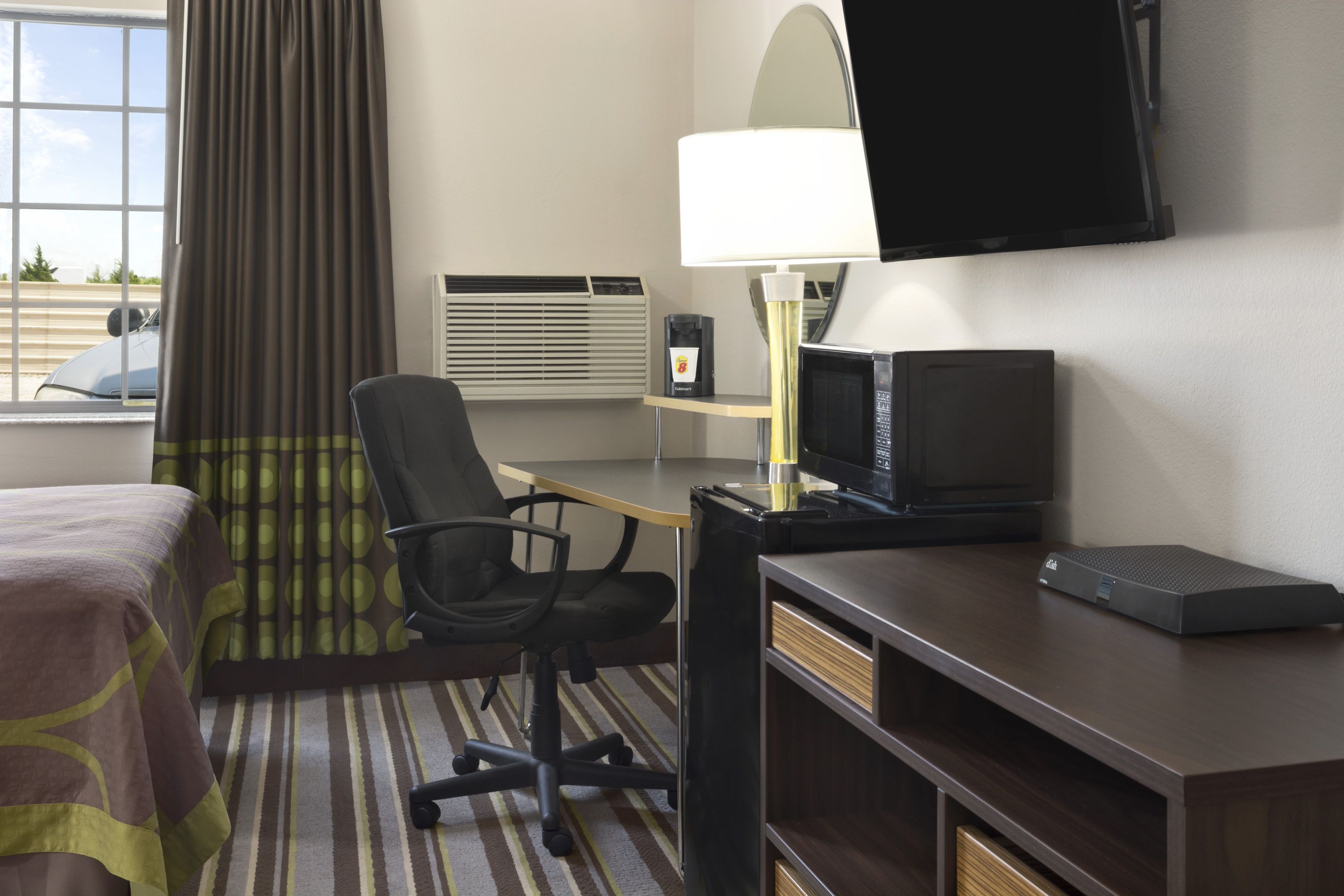 Guest room at the Super 8 by Wyndham Ardmore in Ardmore, Oklahoma