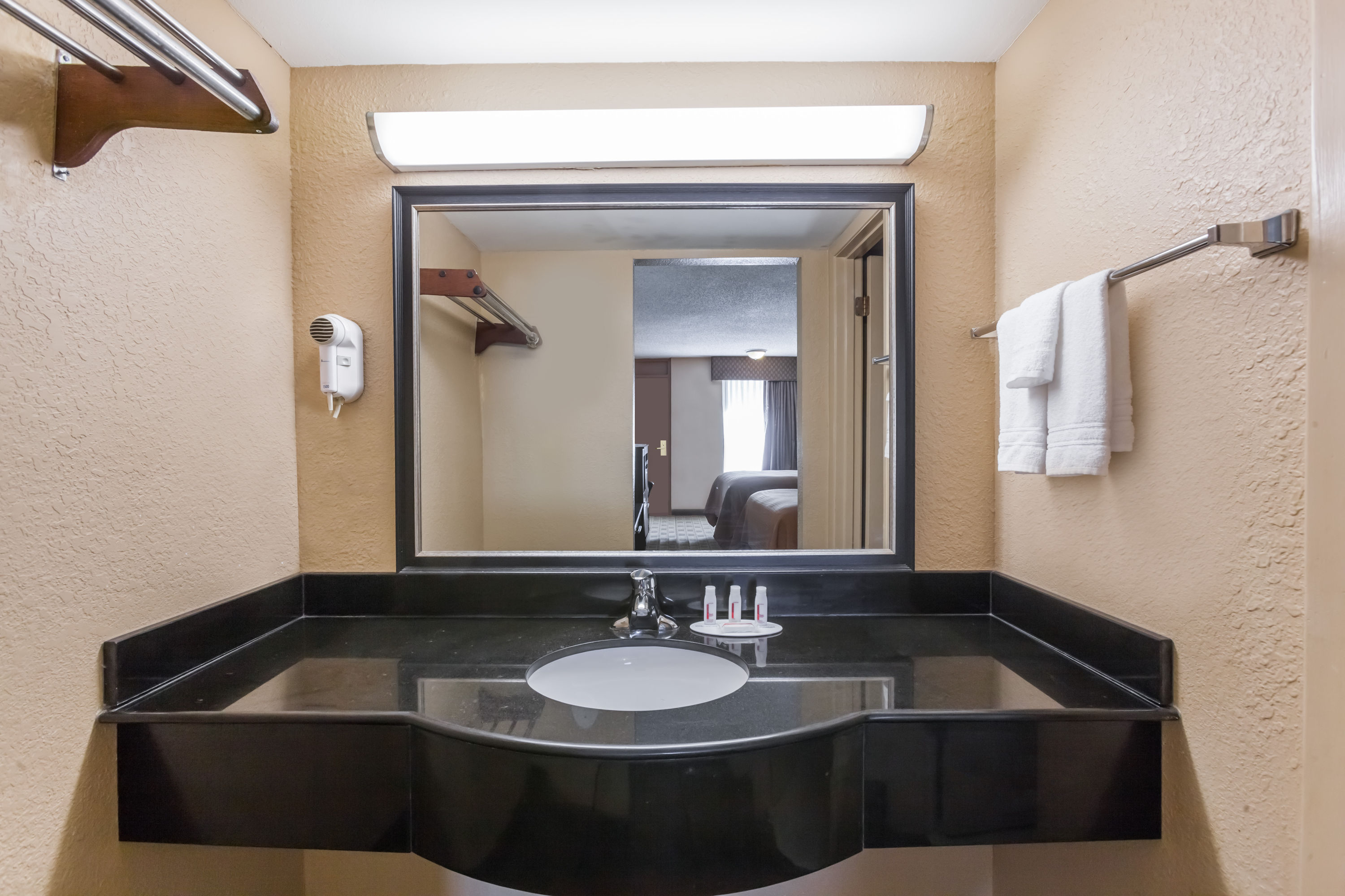 Guest room bath at the Super 8 by Wyndham Atoka in Atoka, Oklahoma