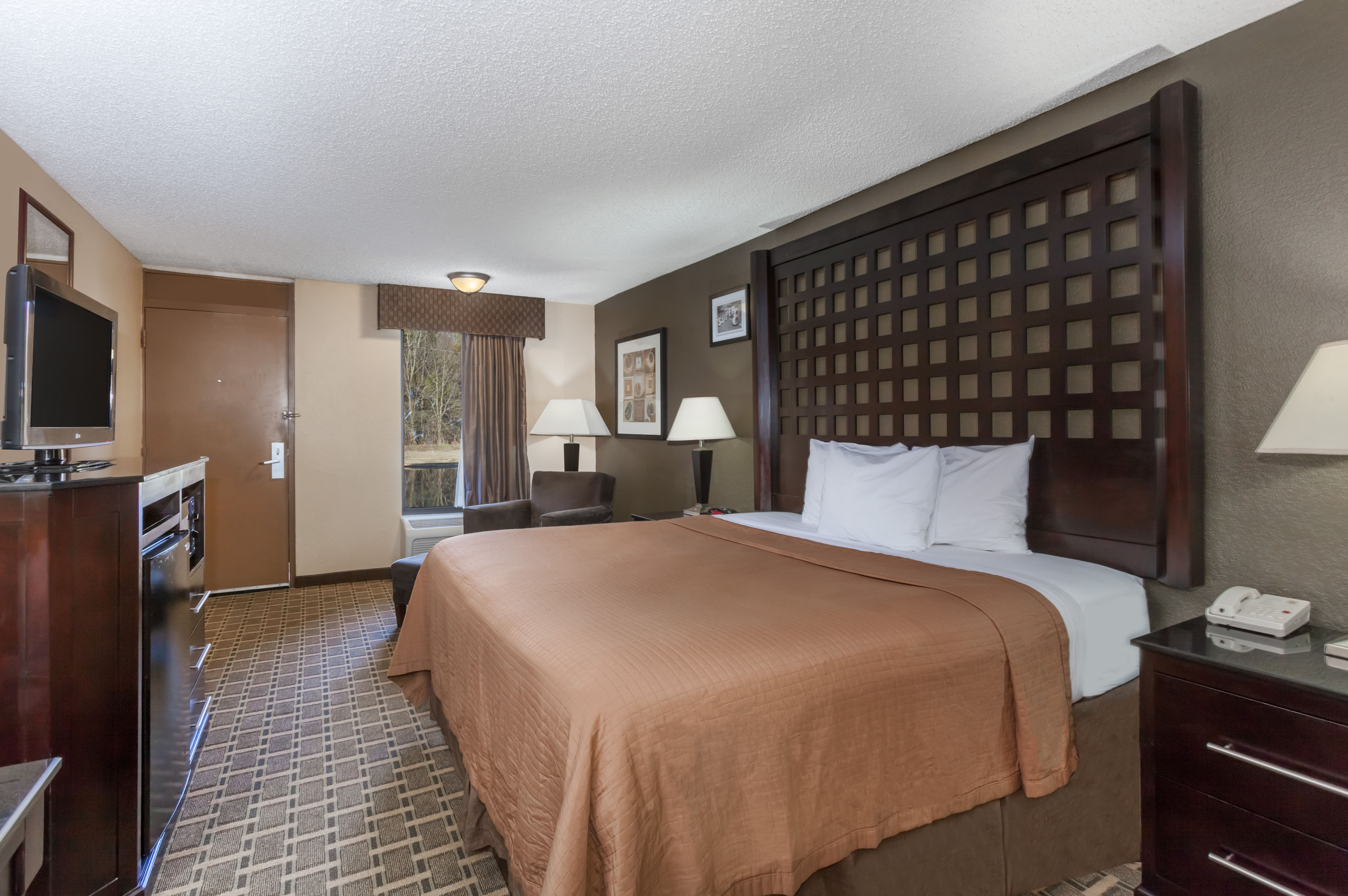Guest room at the Super 8 by Wyndham Atoka in Atoka, Oklahoma
