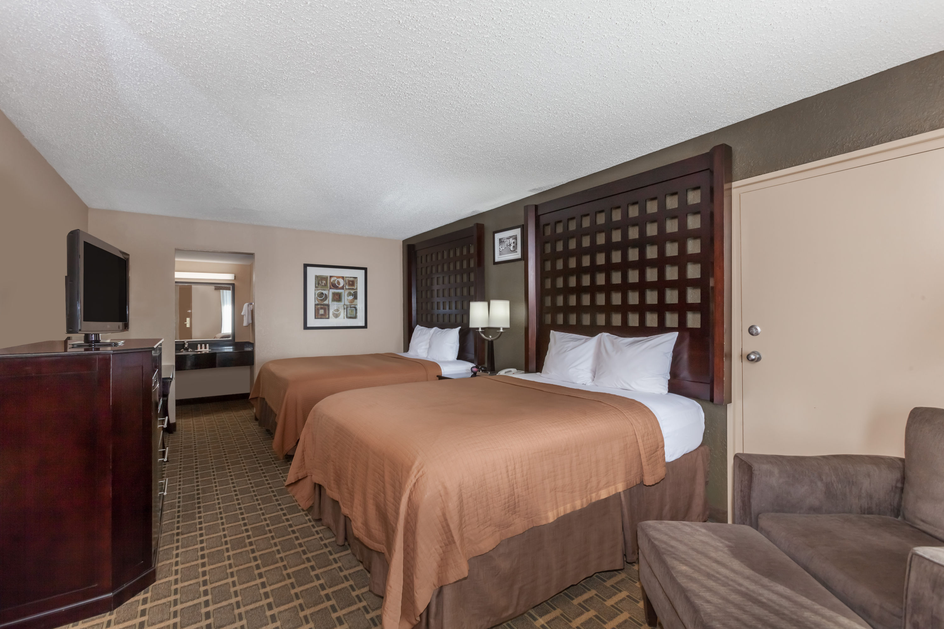 Guest room at the Super 8 by Wyndham Atoka in Atoka, Oklahoma