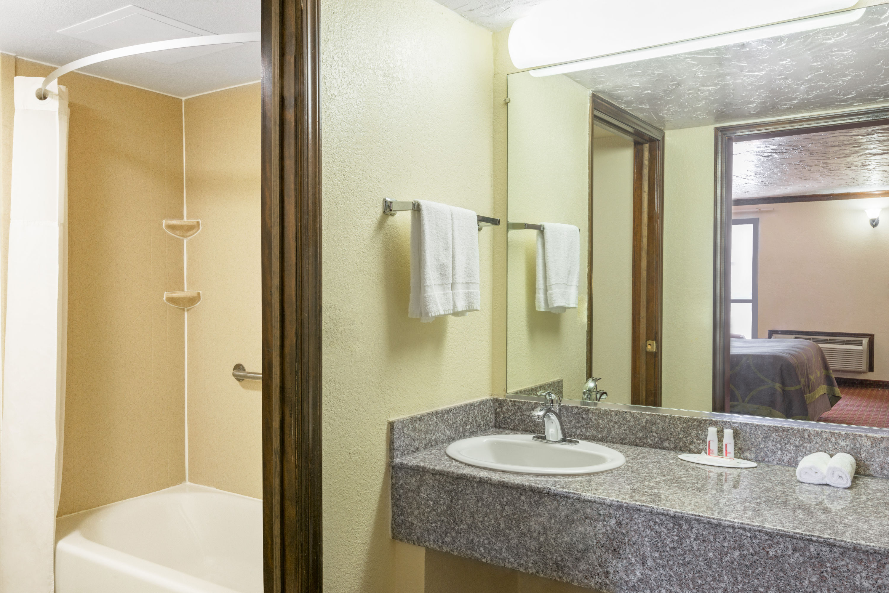 Guest room bath at the Super 8 by Wyndham Enid in Enid, Oklahoma