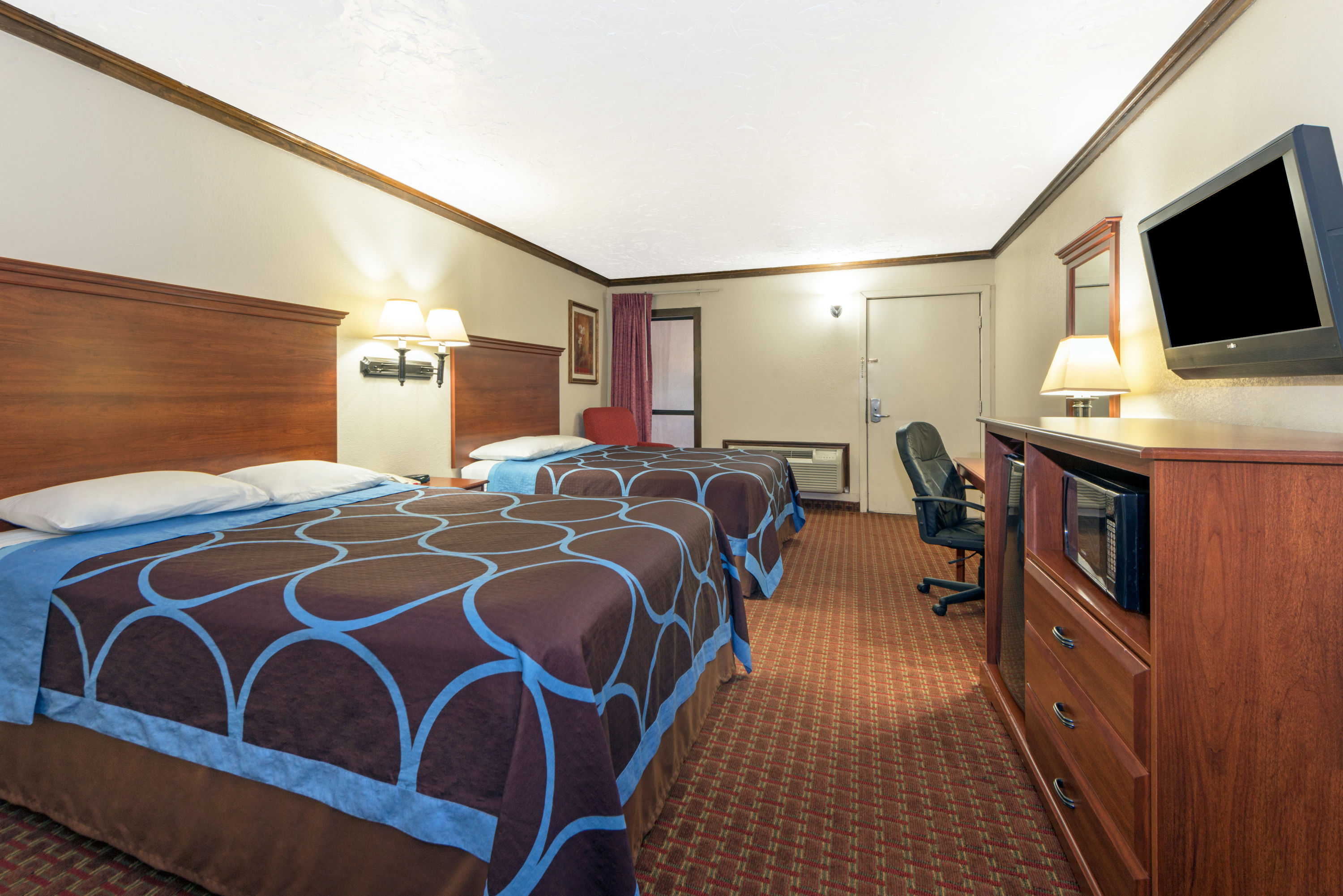 Guest room at the Super 8 by Wyndham Enid in Enid, Oklahoma