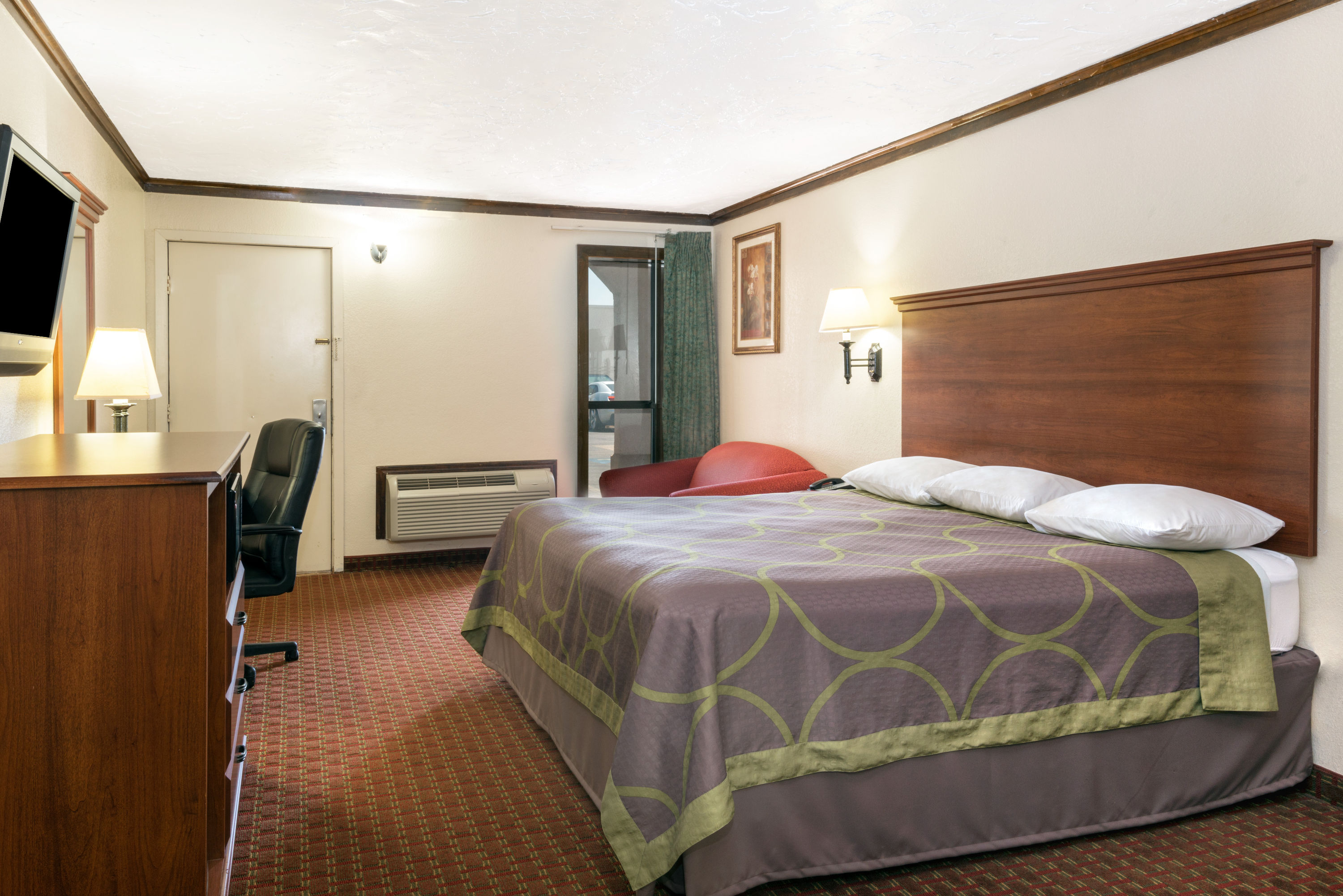 Guest room at the Super 8 by Wyndham Enid in Enid, Oklahoma