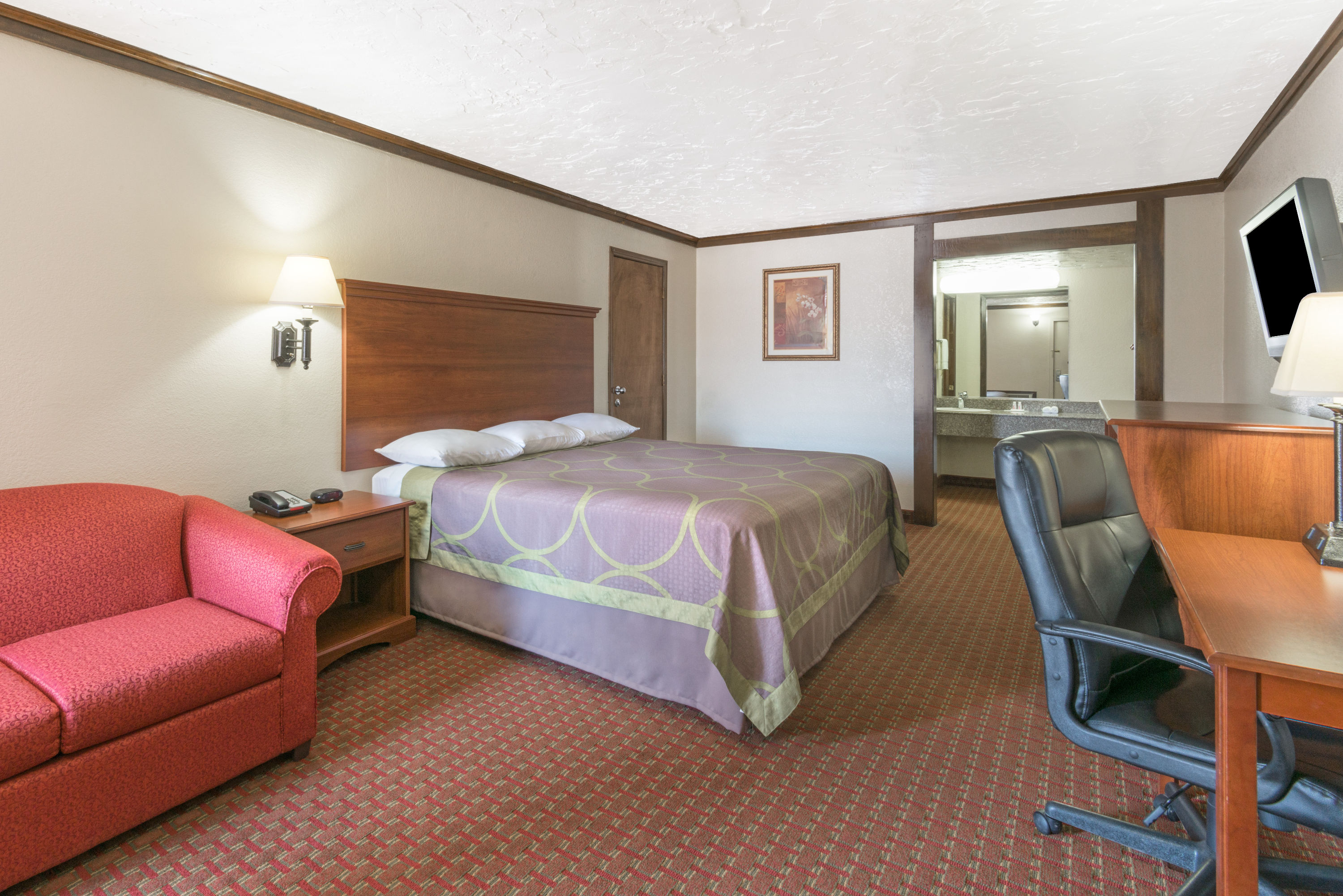 Guest room at the Super 8 by Wyndham Enid in Enid, Oklahoma