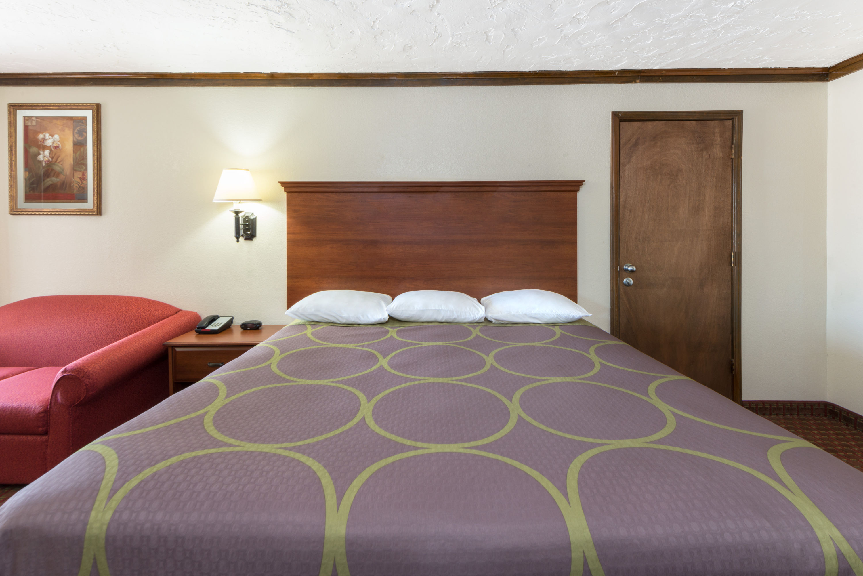 Guest room at the Super 8 by Wyndham Enid in Enid, Oklahoma