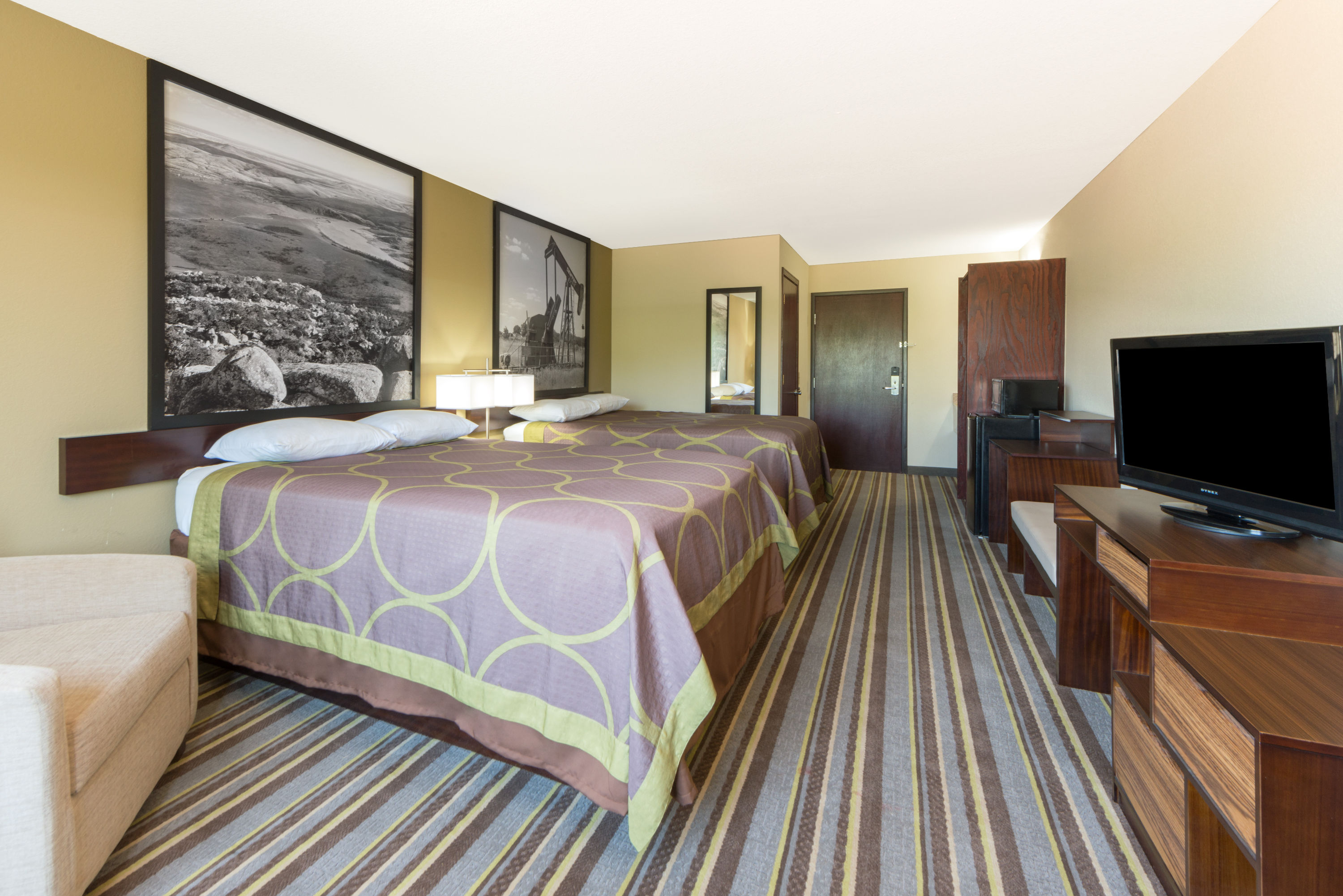 Guest room at the Super 8 by Wyndham Perry in Perry, Oklahoma