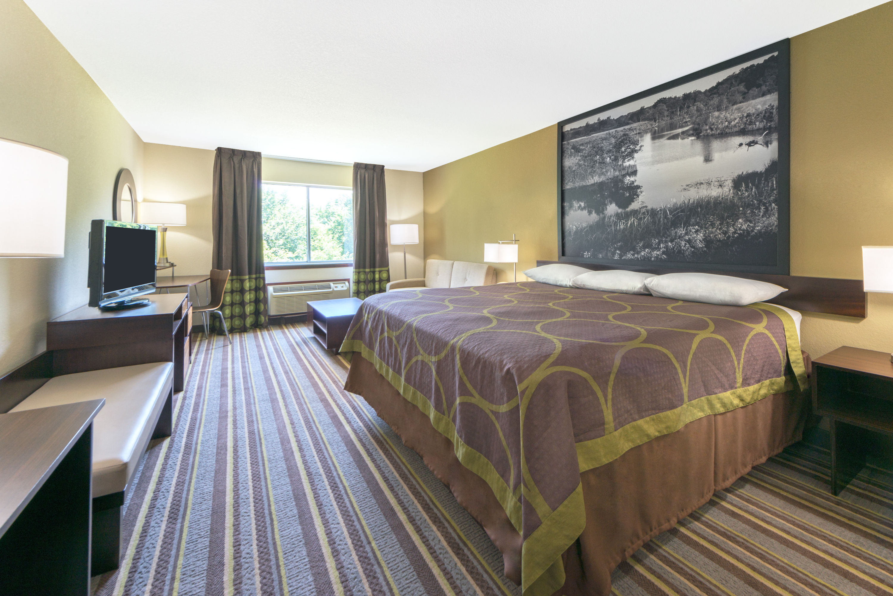 Guest room at the Super 8 by Wyndham Perry in Perry, Oklahoma